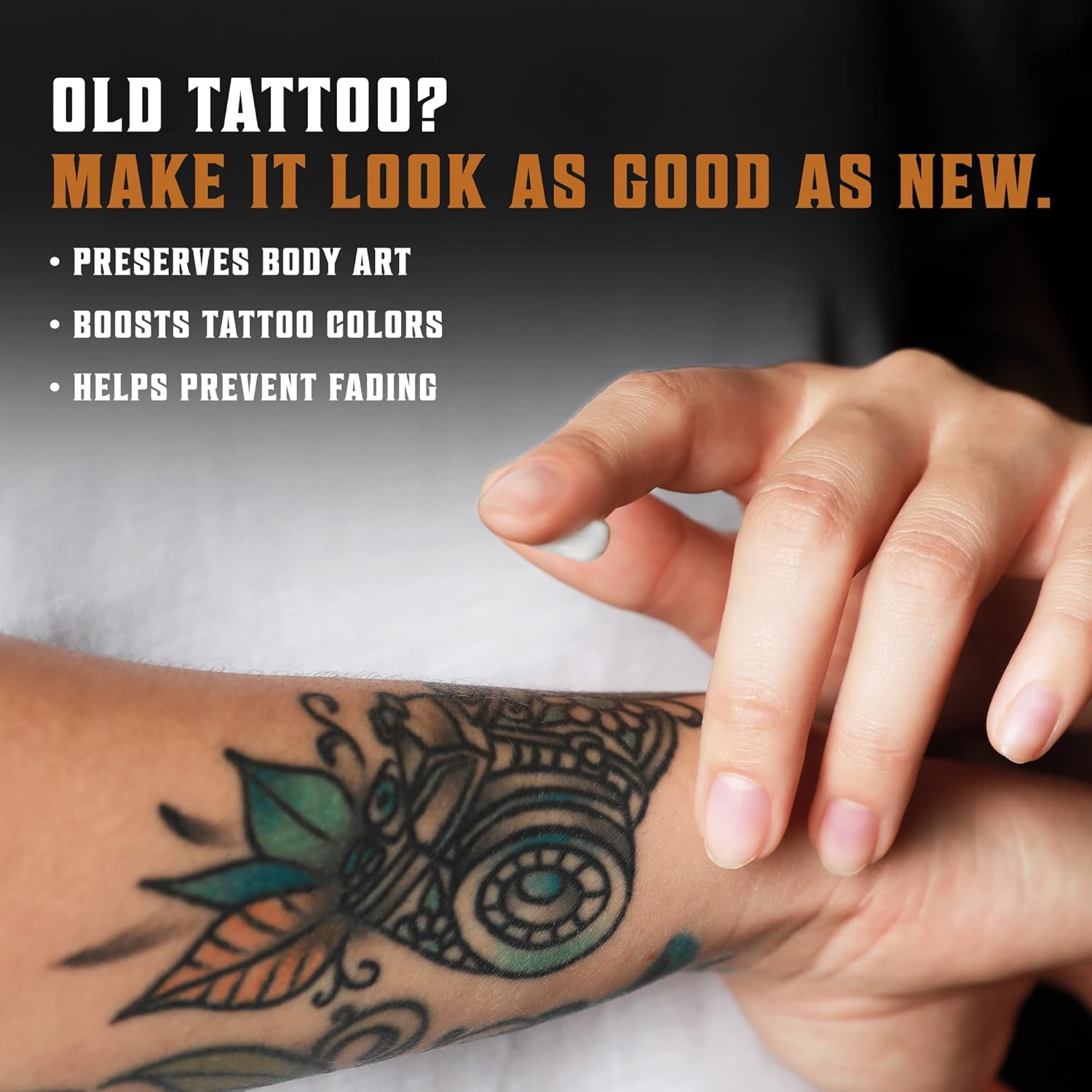 A hand touches a colorful tattooed arm; Tattoo Care Balm - 2 Pack keeps ink vibrant and lasting.