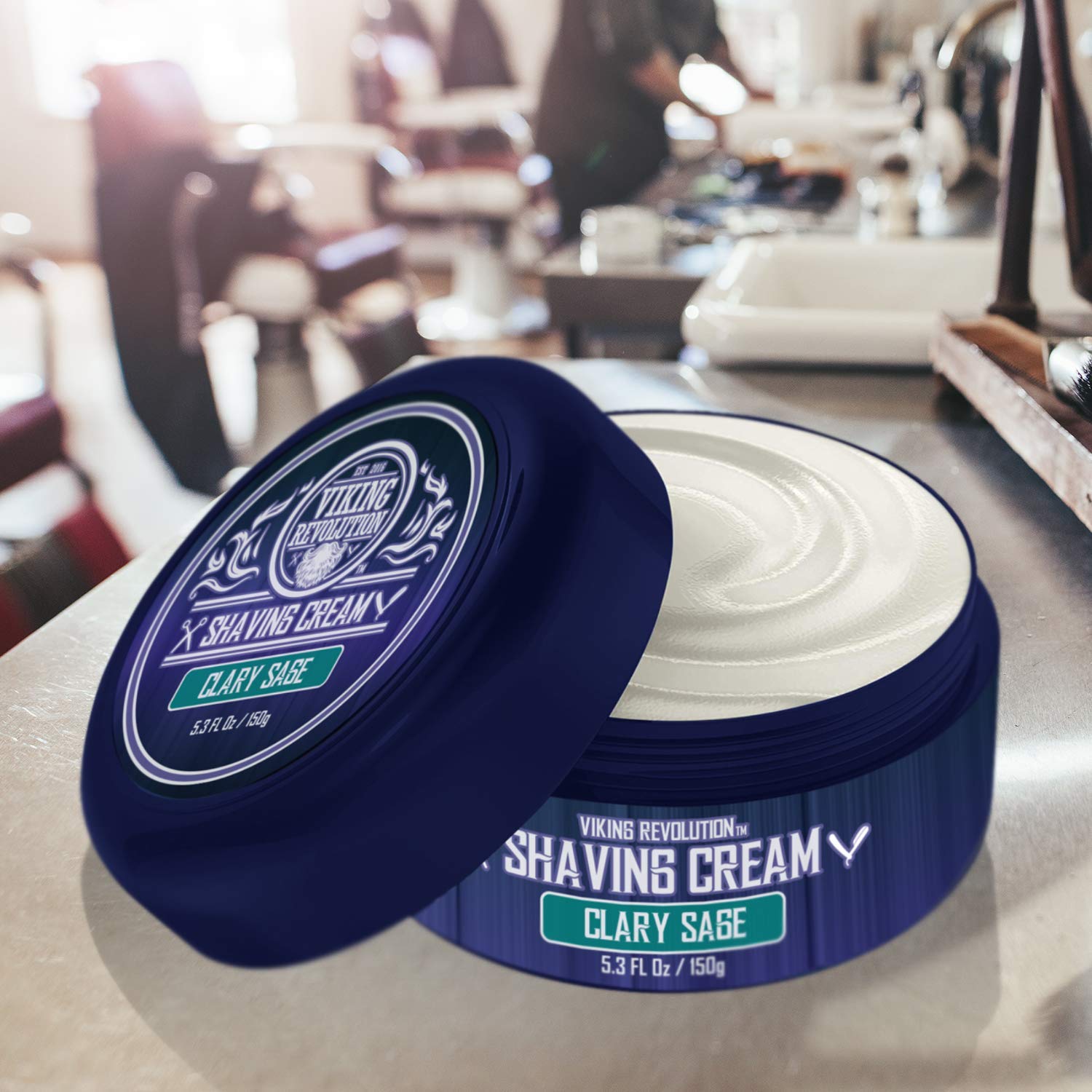 An open container of Clary Sage Shaving Cream (3.5 fl oz) sits on a barbershop counter.