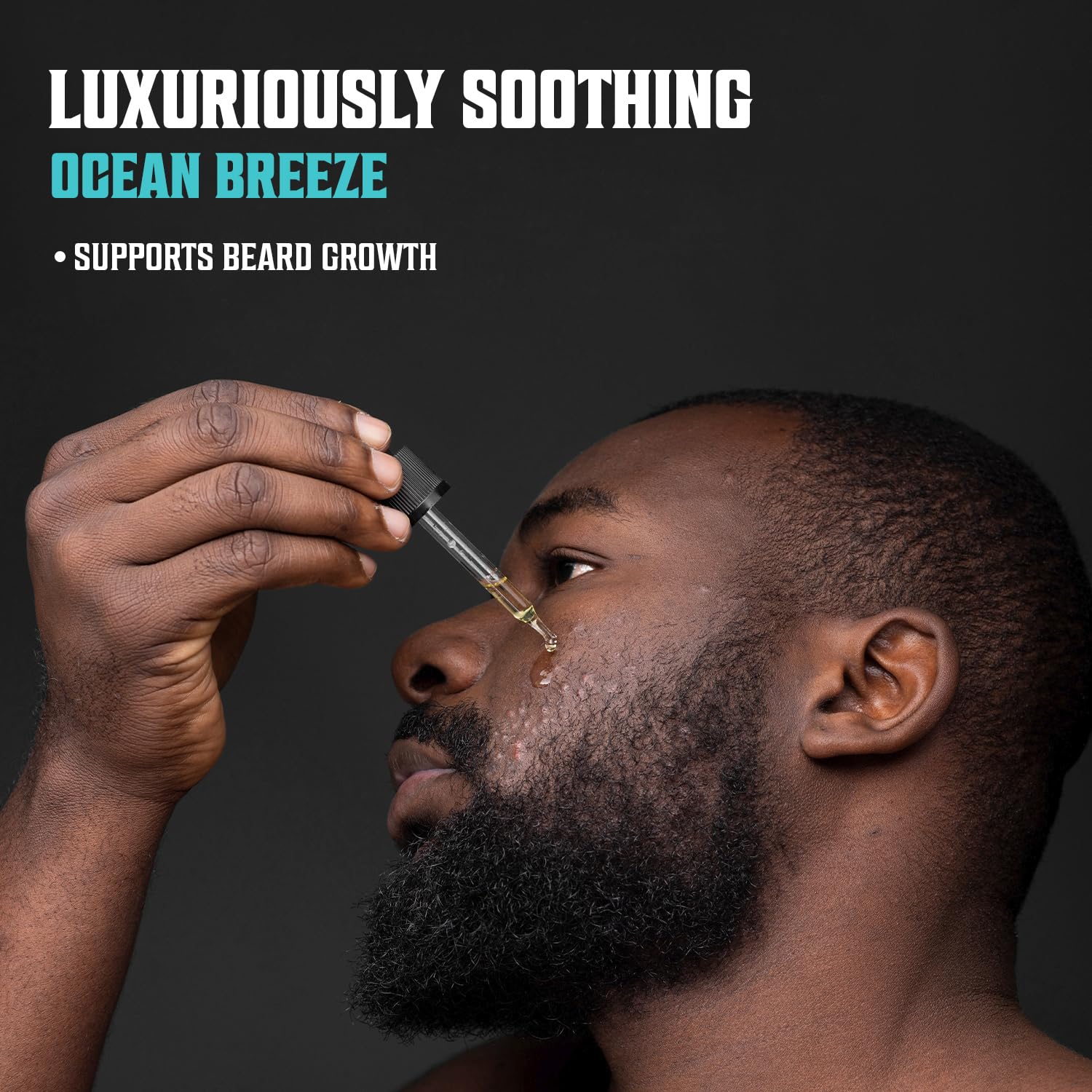 Man applying Sea Salt Beard Oil with dropper, soothing sea salt scent, supports beard growth.