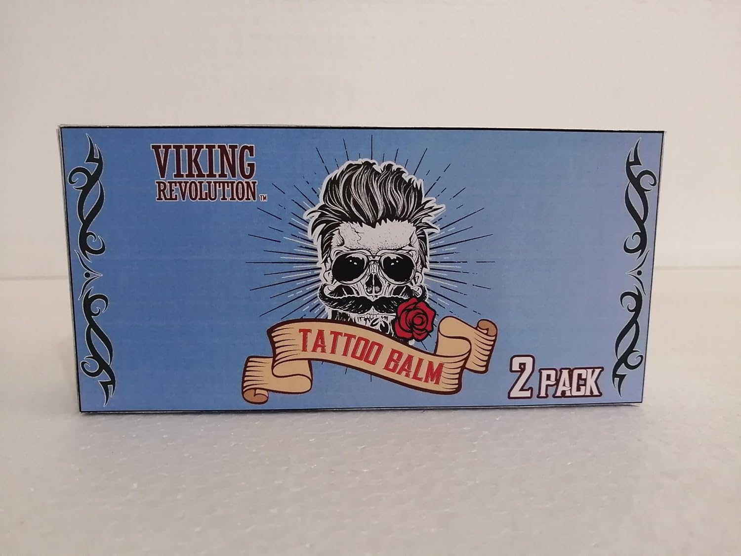 Blue box with skull and rose, Tattoo Care Balm - 2 Pack by Viking Revolution for tattoo aftercare.