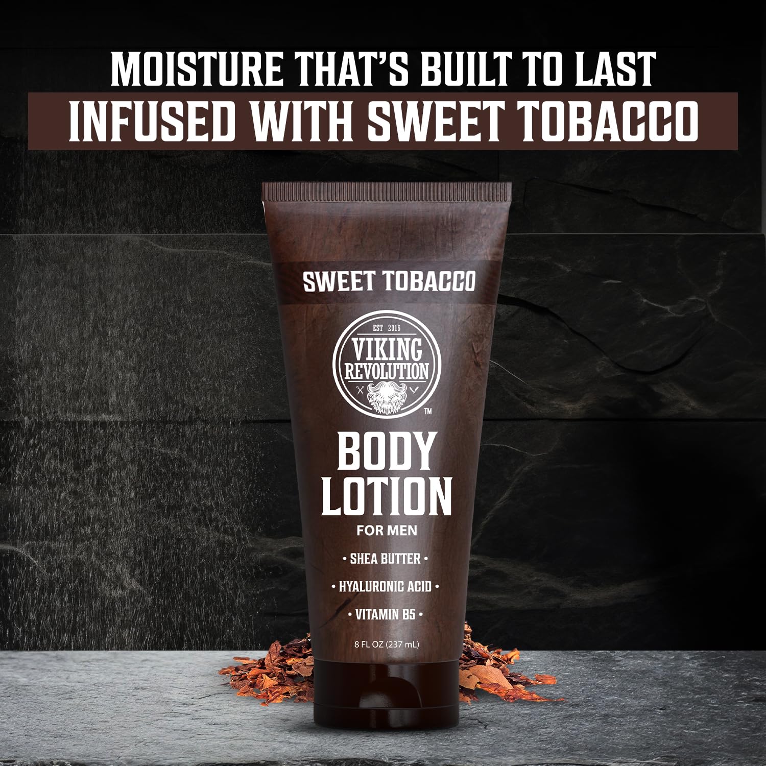 Brown tube of Body Lotion for Men - Sweet Tobacco, standing on tobacco leaves.