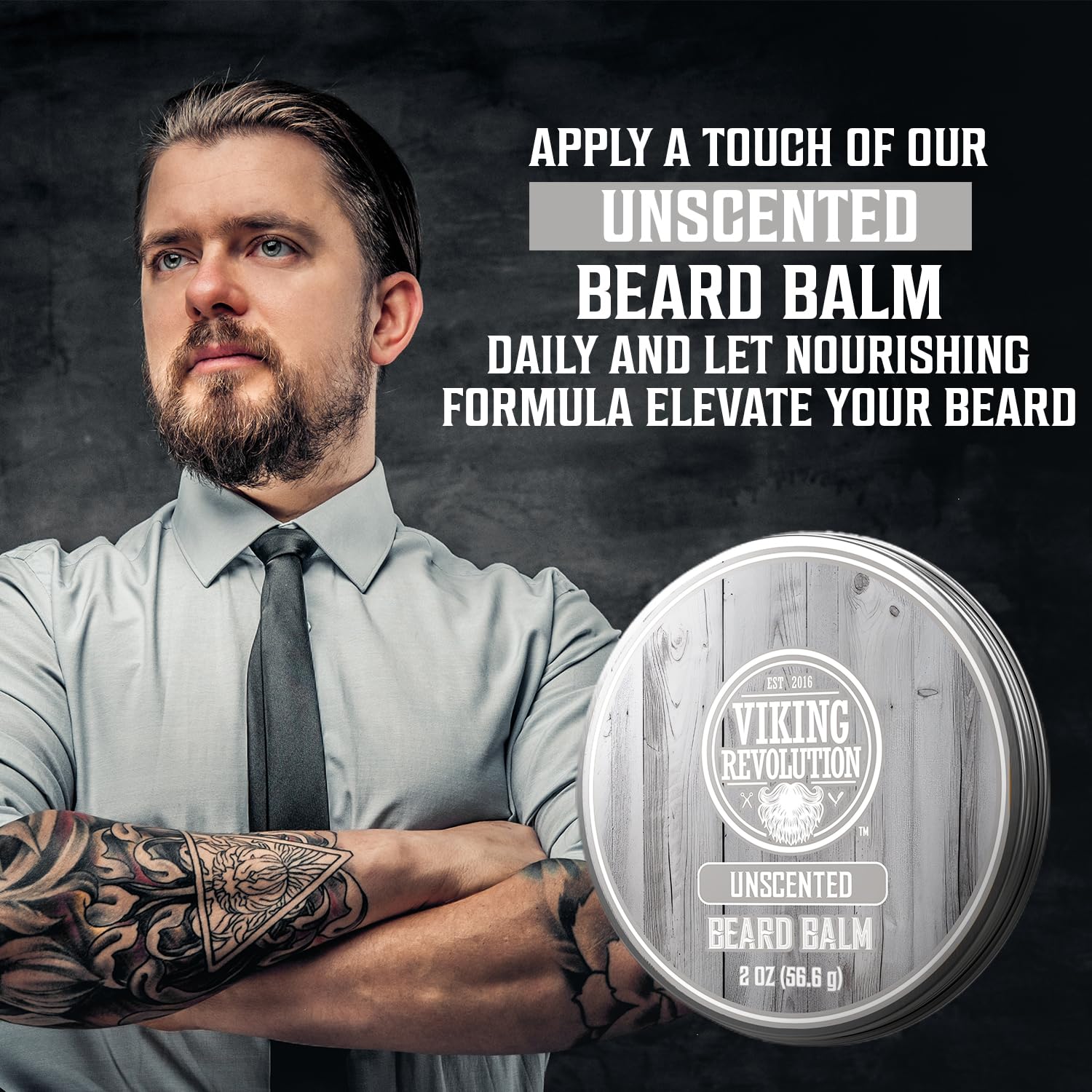Tattooed man stands confidently next to a tin of Unscented Beard Balm (2oz) for natural care.