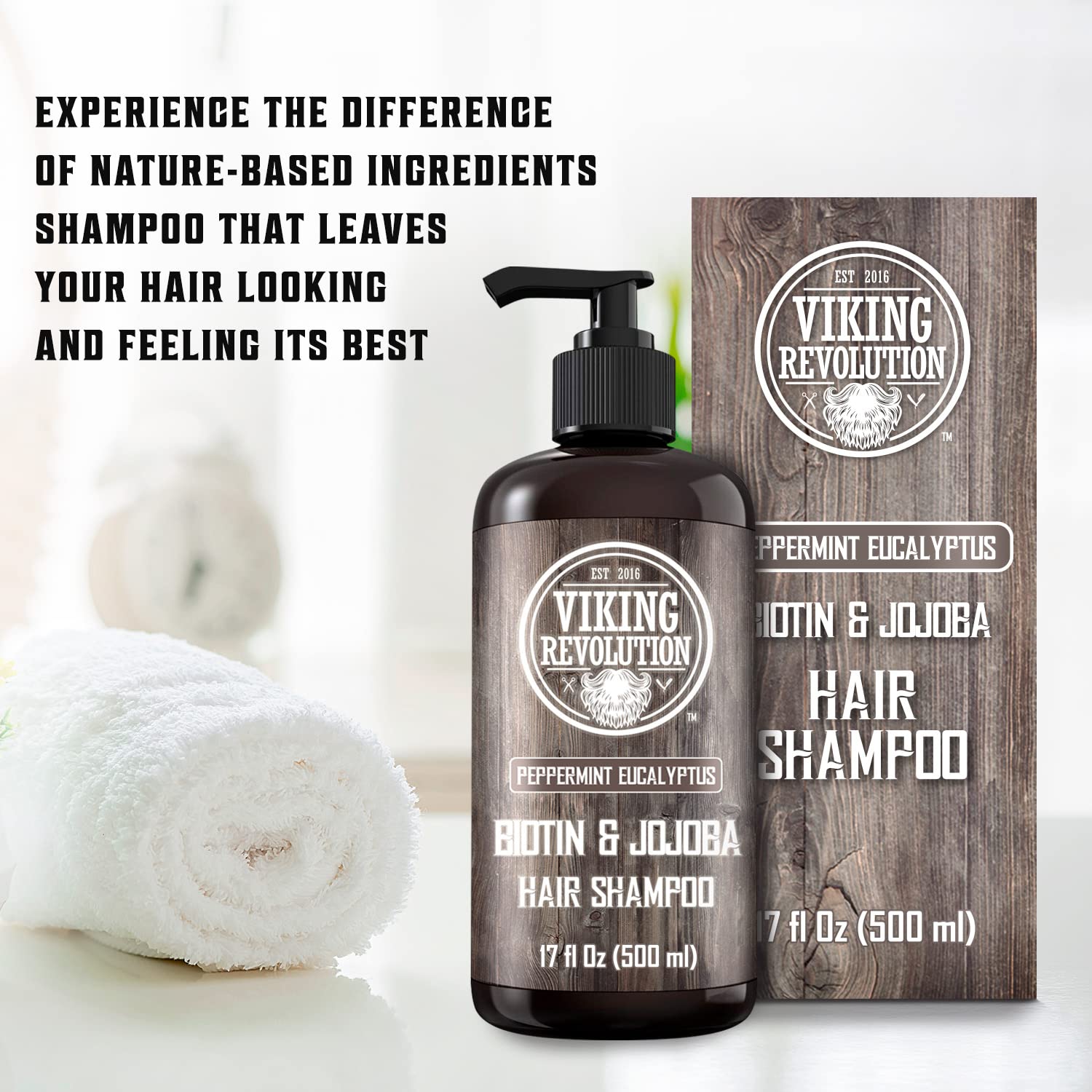 Eucalyptus and Peppermint Shampoo -17oz bottle with natural ingredients next to a rolled towel on wood.