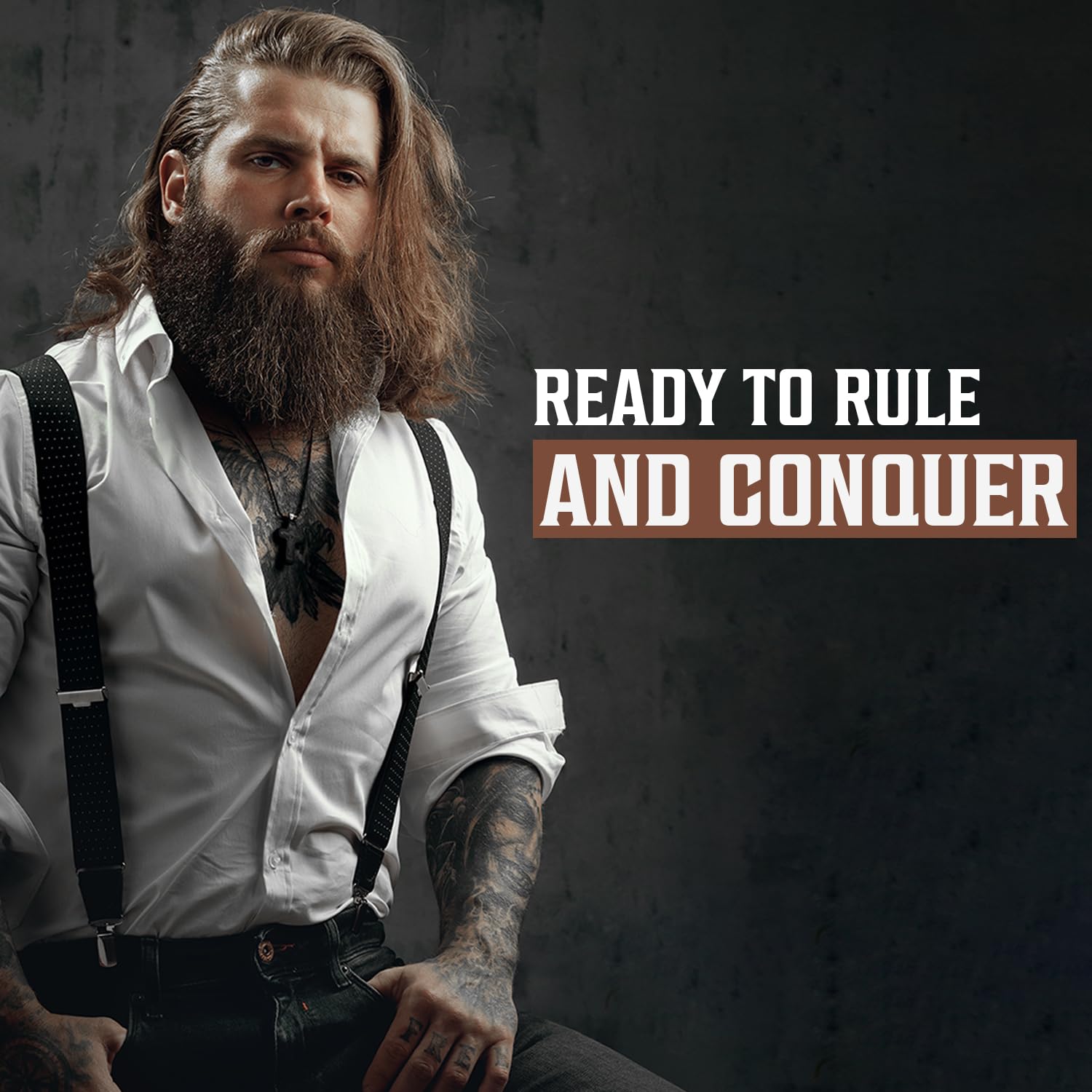 A man sporting long hair and a meticulously groomed beard, highlighting the advantages of using Beard Wash & Conditioner - Majestic Oud 5oz, is dressed in a white shirt with suspenders. Beside him is the text: Ready to Rule and Conquer.