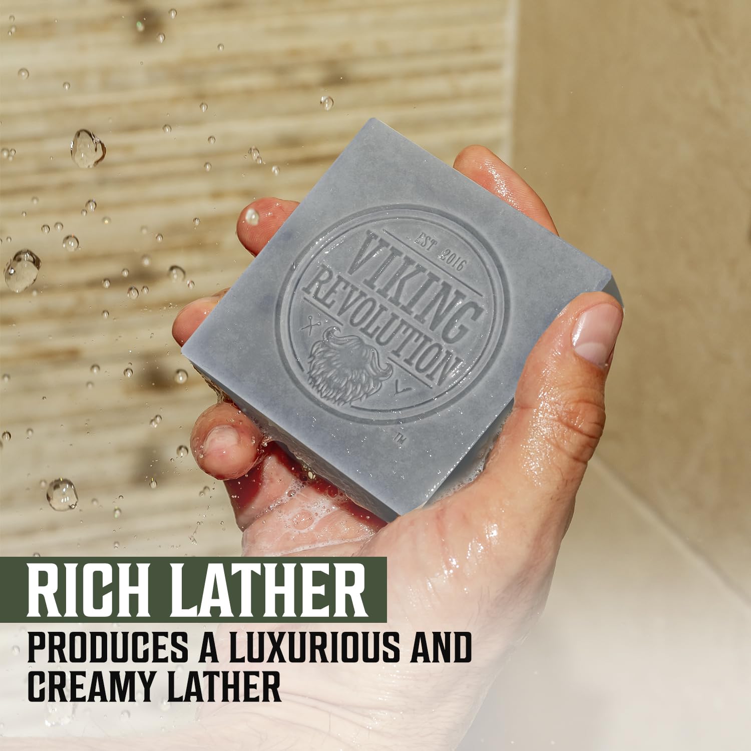 Hand holding Tea Tree Natural Cold Pressed Bar Soap for skin care, under running water. Packaged in 2 pack.