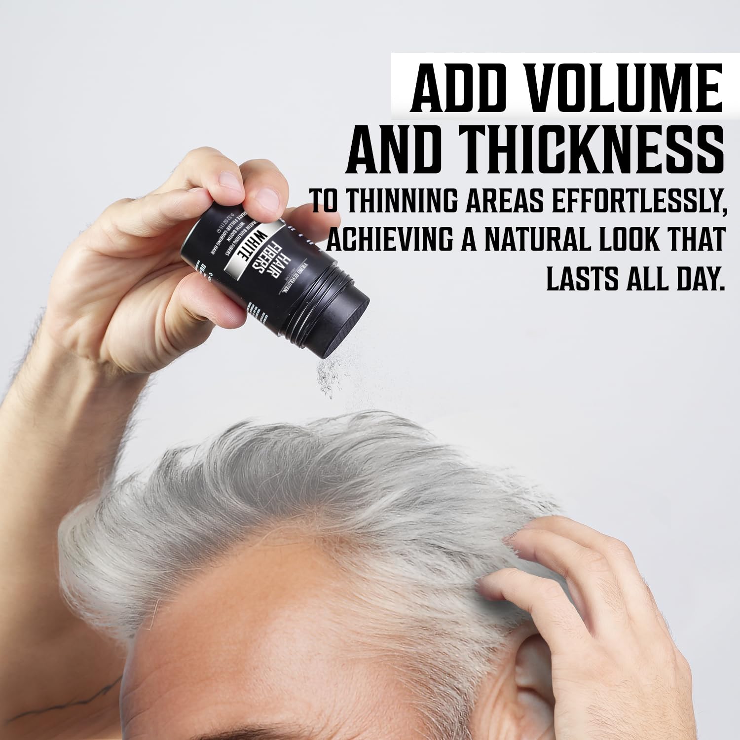 A person uses White Hair Fibers to add volume and thickness to thinning gray hair.