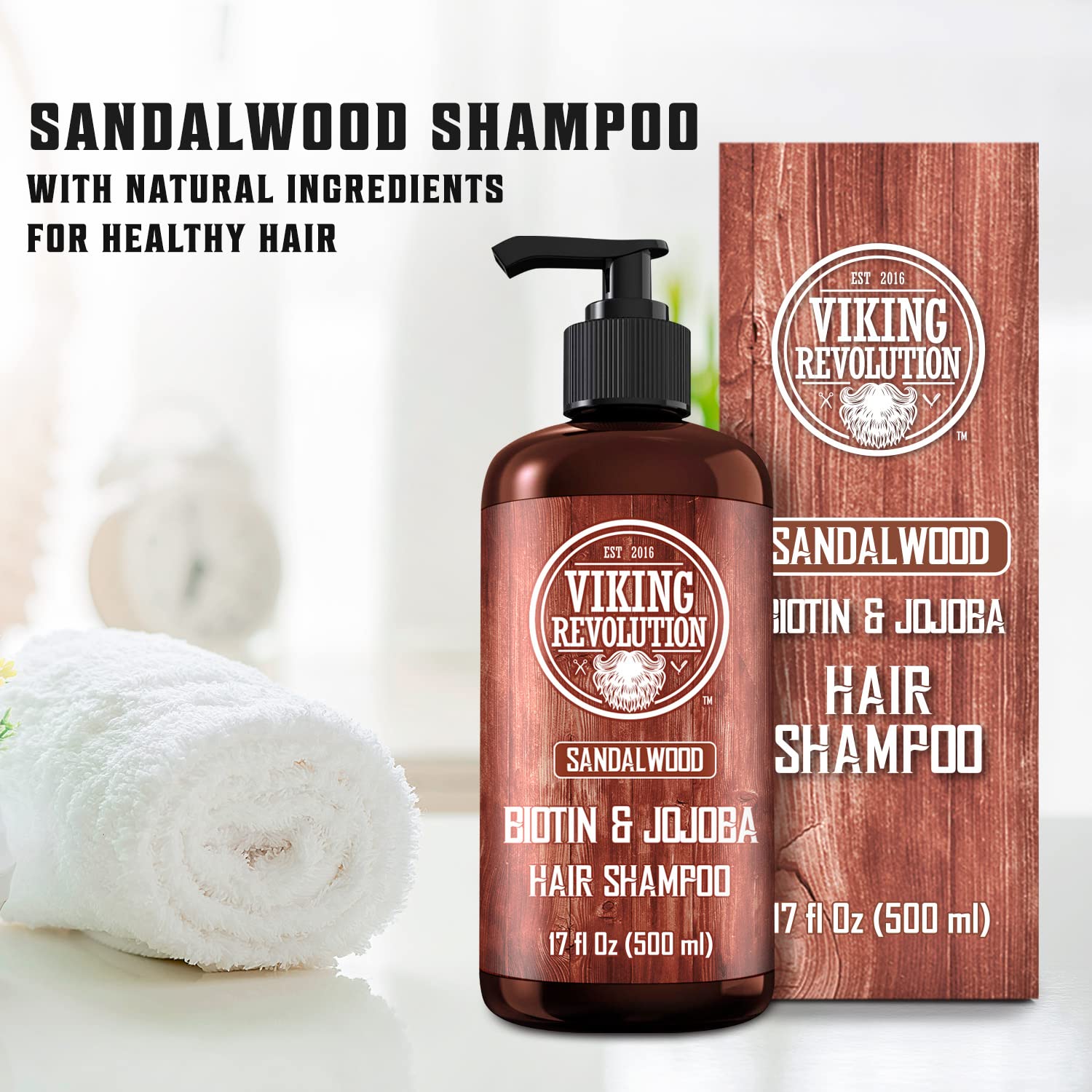 Sandalwood Mens Shampoo with Biotin and Jojoba Oil bottle, box, and towel on a white surface.