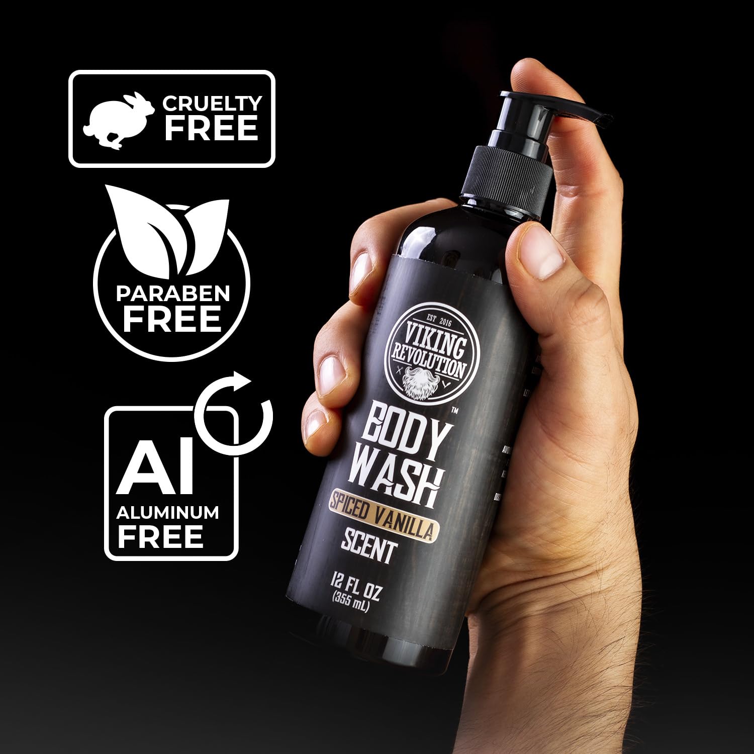 A hand holds a bottle from the Body Wash - Spiced Vanilla 2 pack, crafted as a natural body wash for men, against a sleek black background.