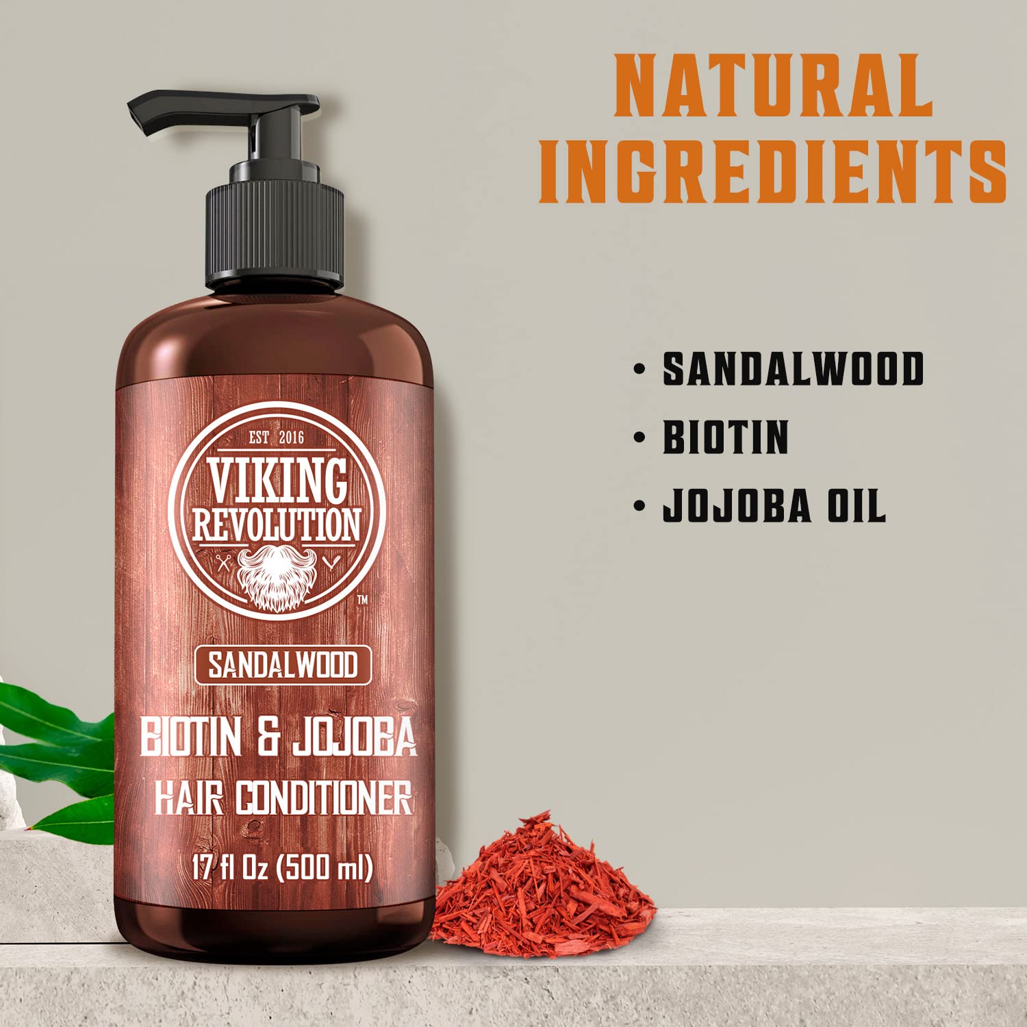 The Sandalwood Conditioner with Biotin and Jojoba Oil (17 Oz) by Viking Revolution includes ingredients like sandalwood oil, biotin, and jojoba oil in a 17 fl oz (500 ml) bottle.