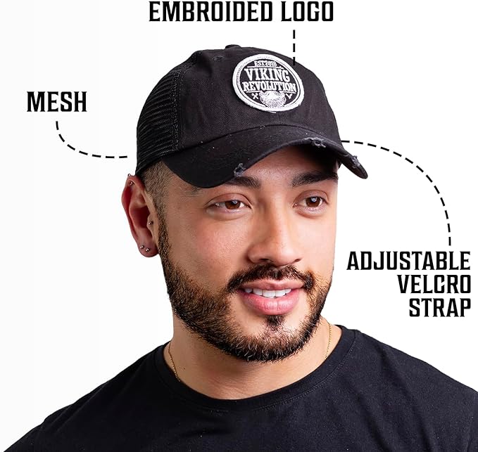 A man sporting the Trucker hat for men, featuring a black fabric with an embroidered logo, mesh back, and adjustable Velcro strap, stands out in style. This piece from Viking Revolution adds a rugged twist to men's hats.