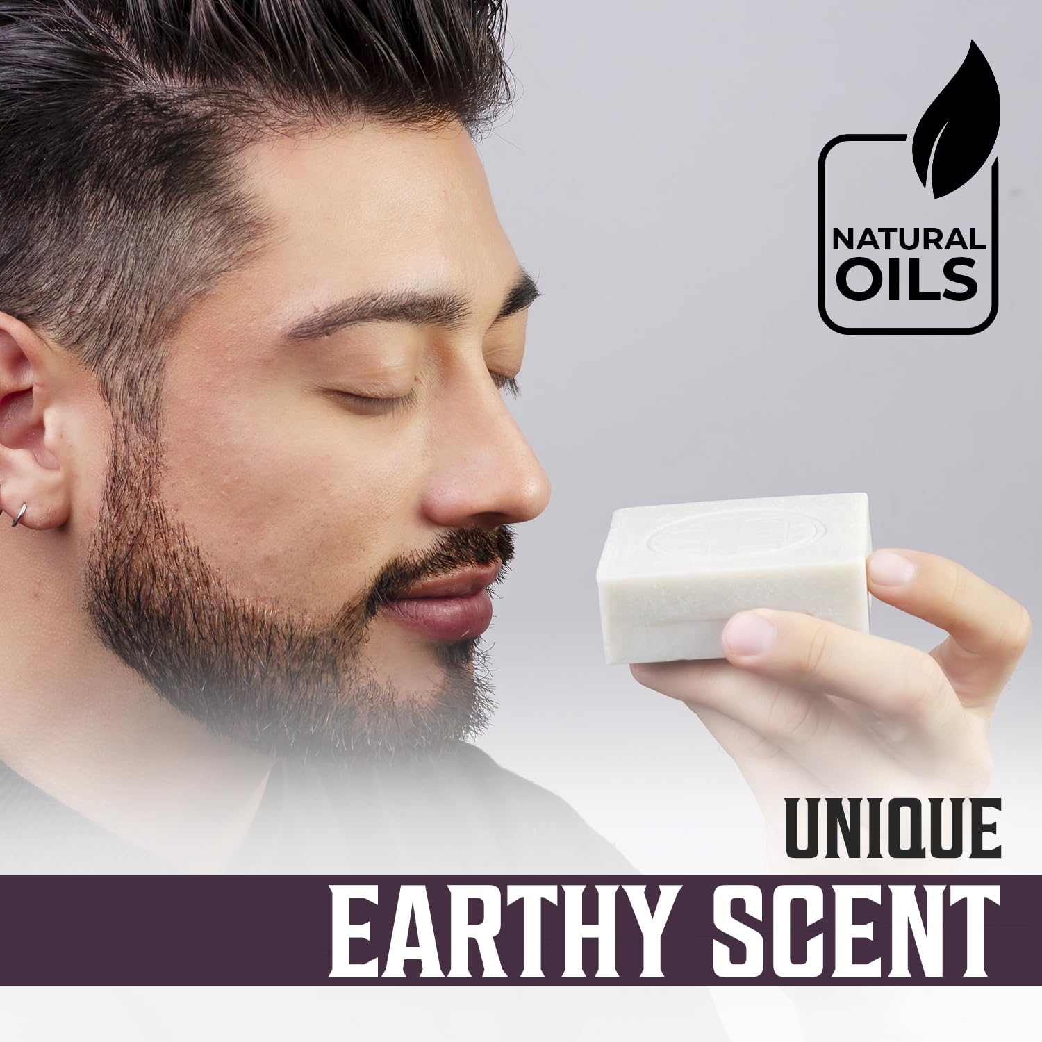 Man enjoying the scent of Clary Sage Natural Cold Pressed Bar Soap - 2pk with its logo.
