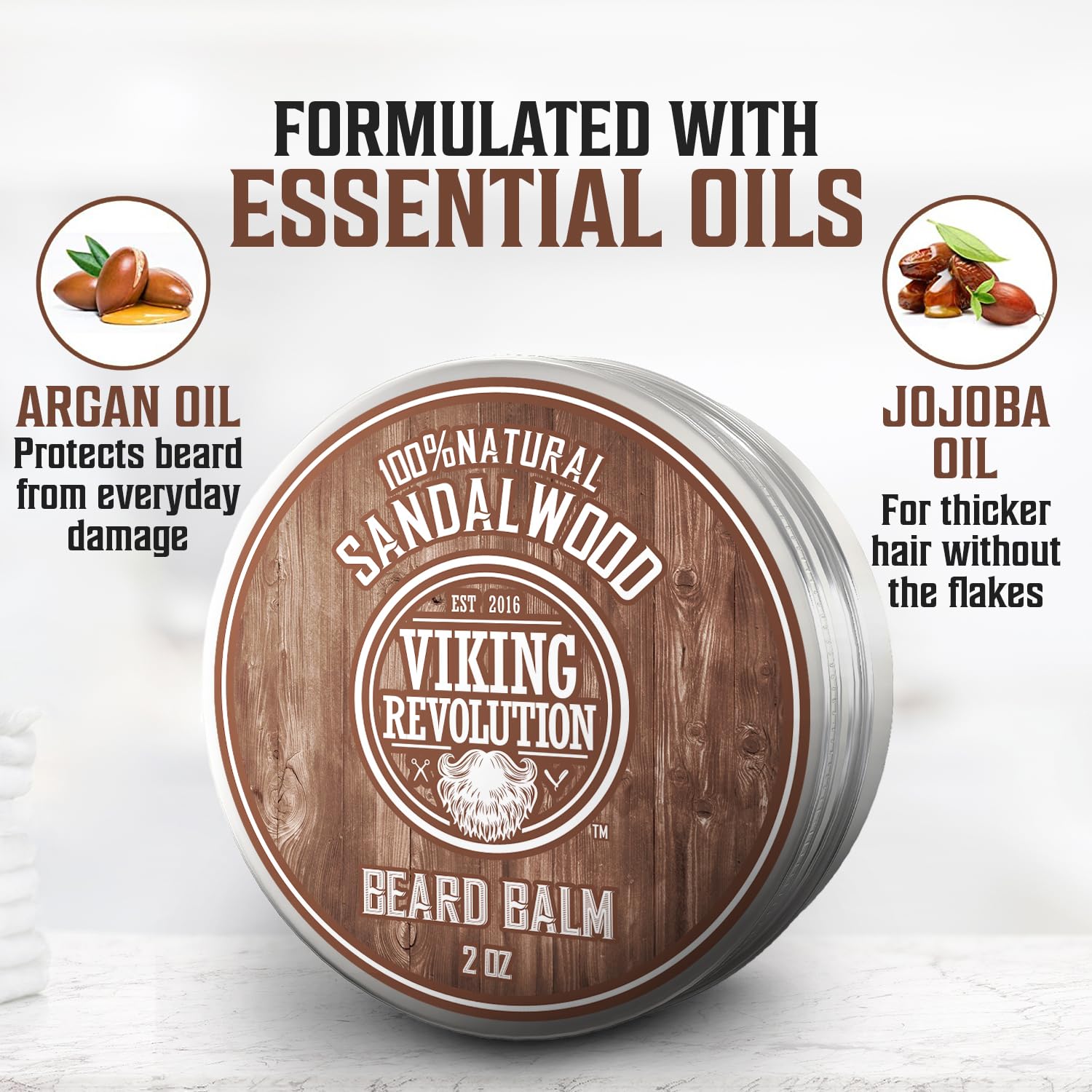 A 2oz round tin of Beard Balm in Sandalwood Scent, enriched with essential oils, argan oil, and jojoba oil benefits highlighted, designed to help prevent beardruff.