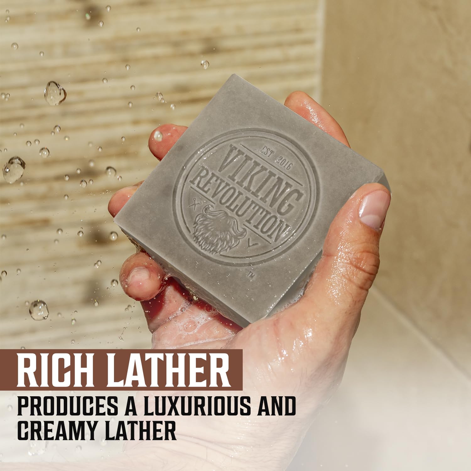A hand holds a bar of Sandalwood Natural Cold Pressed Bar Soap under water. Text: Rich Lather with the essence of sandalwood.