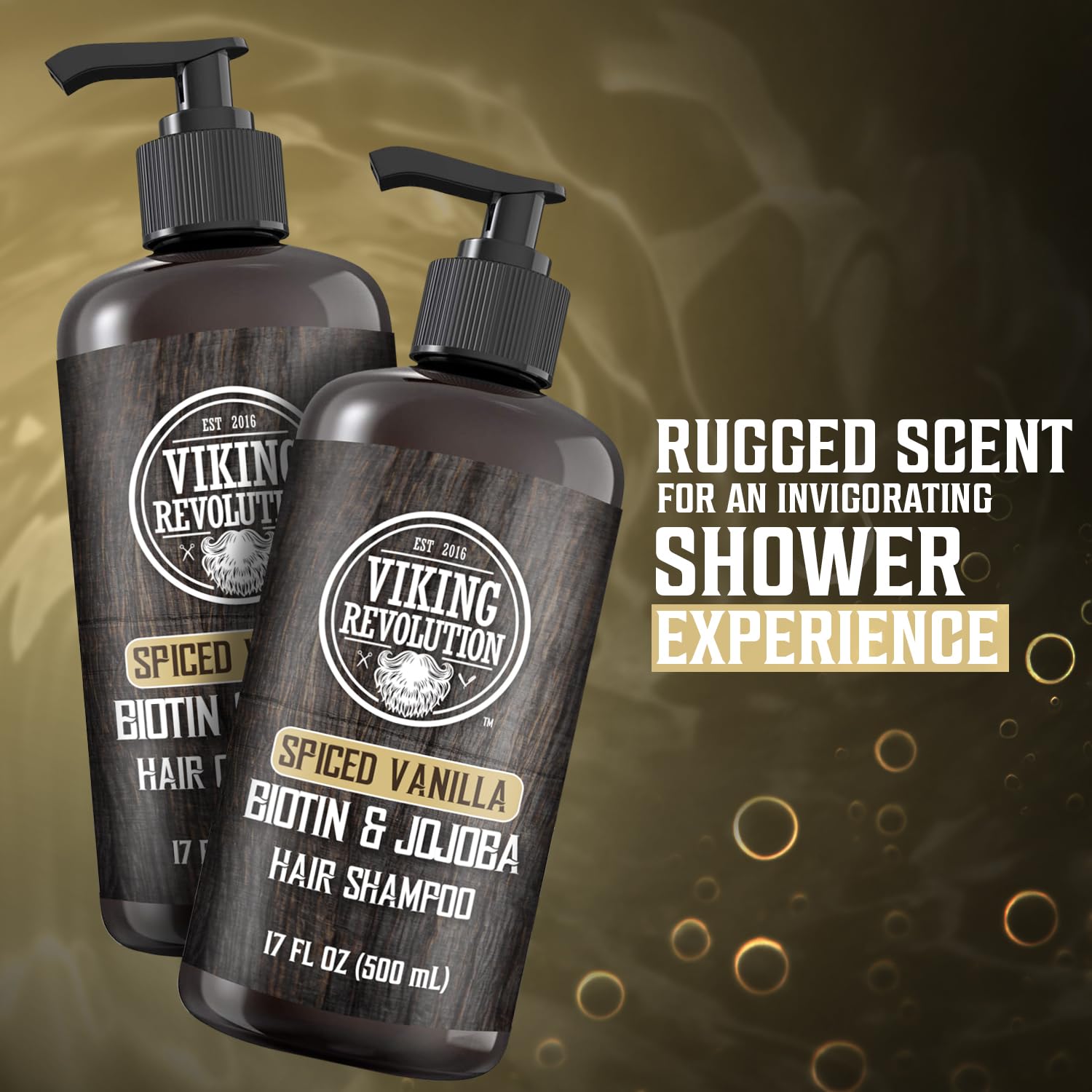 Two bottles of Spiced Vanilla Hair Shampoo & Conditioner, each 17oz, sit on a misty dark background. The formula is enriched with jojoba and olive oil for ultimate hair care.