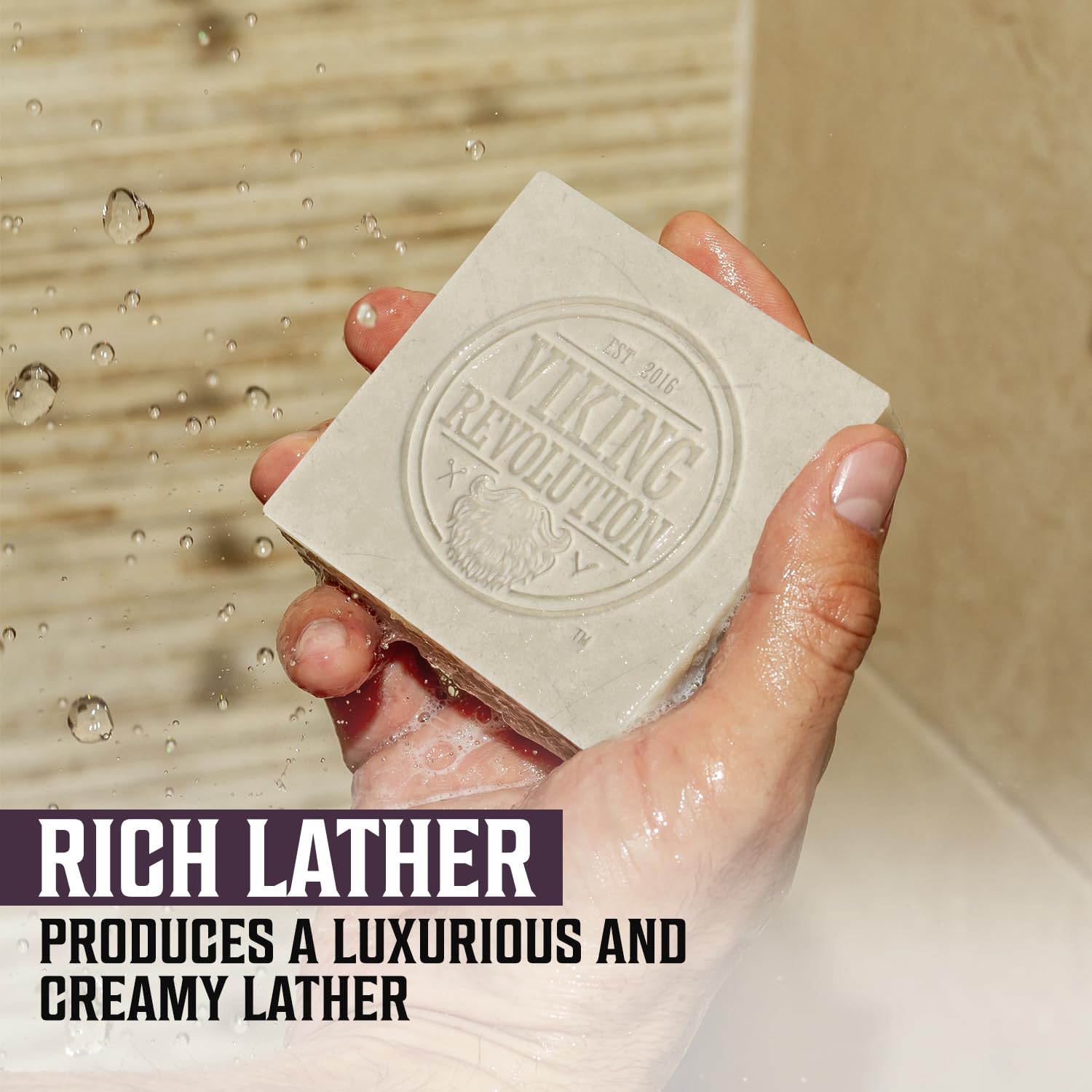 Hand holding Clary Sage Natural Cold Pressed Bar Soap - 2pk under water, text Rich Lather: Luxurious and Creamy.