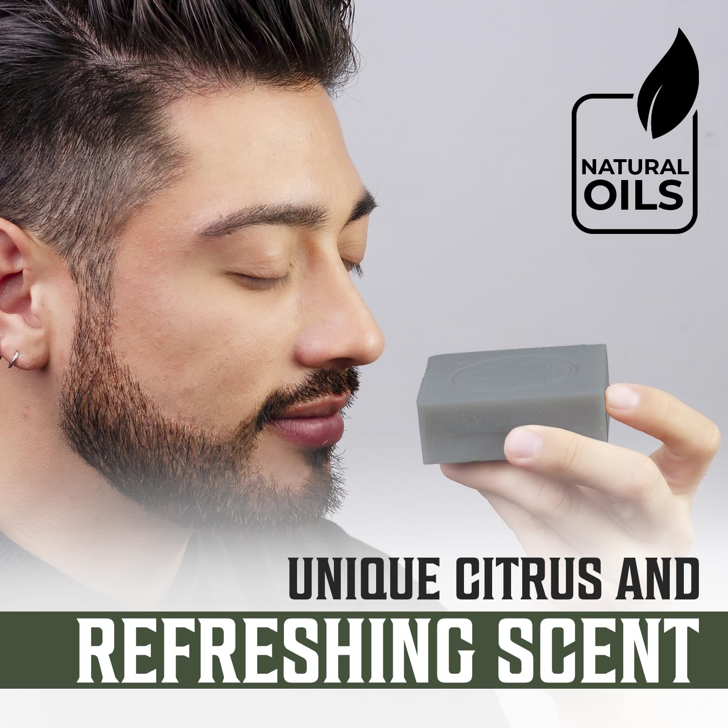 Man smelling Tea Tree Soap with Unique Citrus & Sandalwood Scent. Natural Oils logo visible.