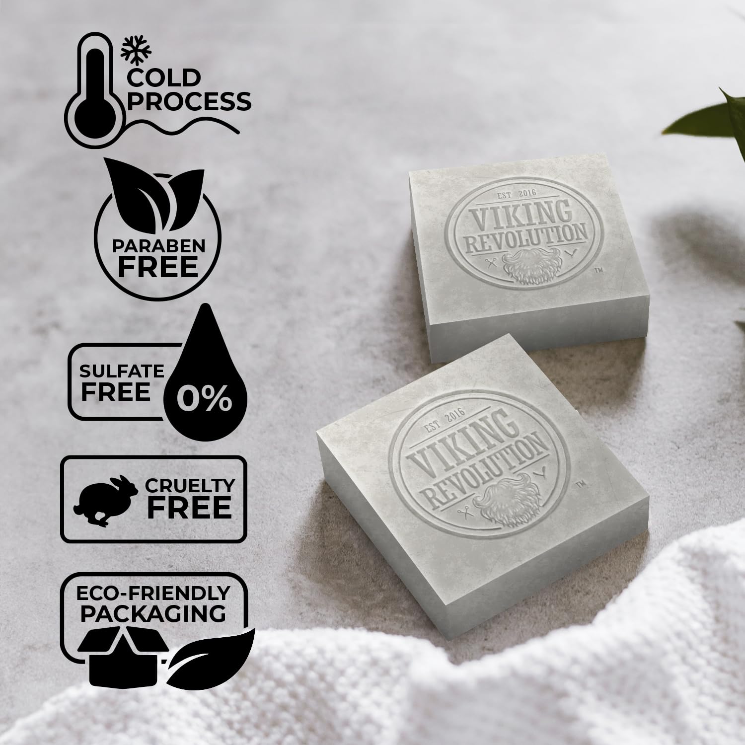 On a light surface, two bars of Viking Revolution Peppermint Natural Soap for Men sit, boasting sulfate and paraben-free formulations. These eco-friendly cold-pressed soaps offer invigorating scents of peppermint and eucalyptus.