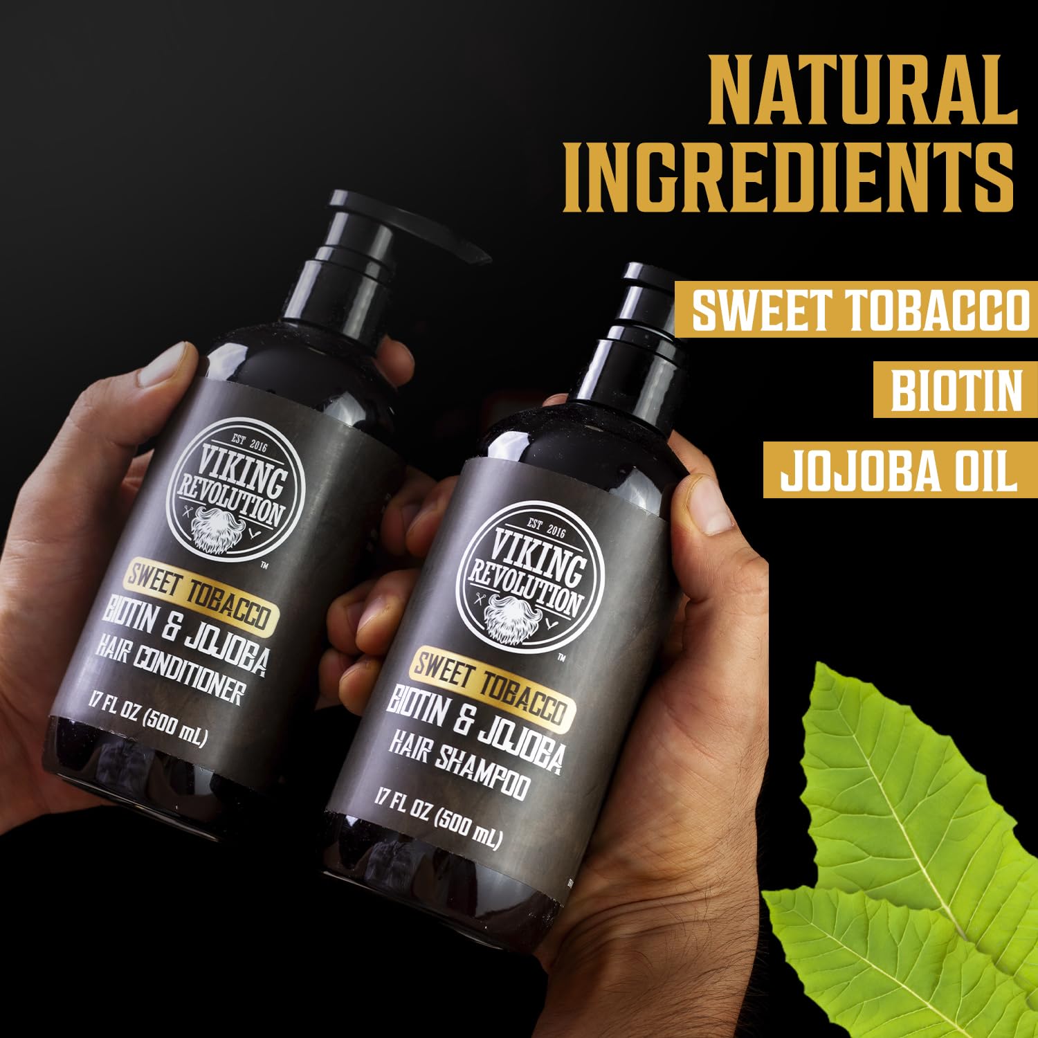 Hands holding Sweet Tobacco Hair Shampoo & Conditioner 17oz by Viking Revolution.