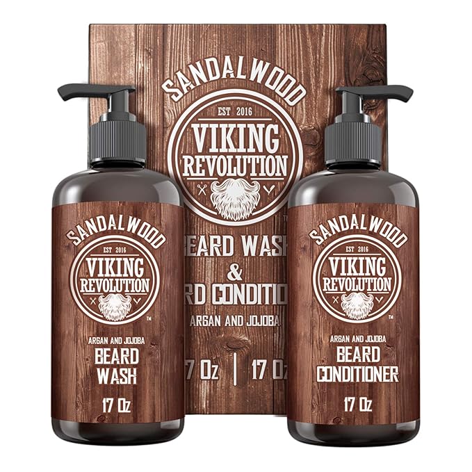 Beard Wash & Conditioner bottles are set against a wooden background, prominently showcasing the Viking Revolution brand. Enriched with all-natural ingredients, this revitalizing facial hair pair supports beard growth and offers a refreshing cleanse.