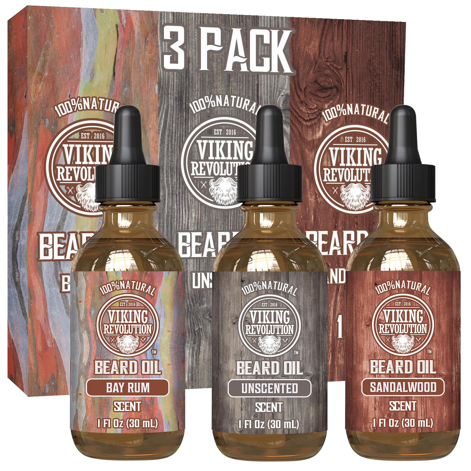 A trio of bottles from the Beard Oil - 3 Pack 1oz by Viking Revolution—featuring Bay Rum, Unscented, and Sandalwood variants—proudly stand in front of their packaging. Renowned for nourishing and taming beards, they also provide effective prevention against beard dandruff with every application.