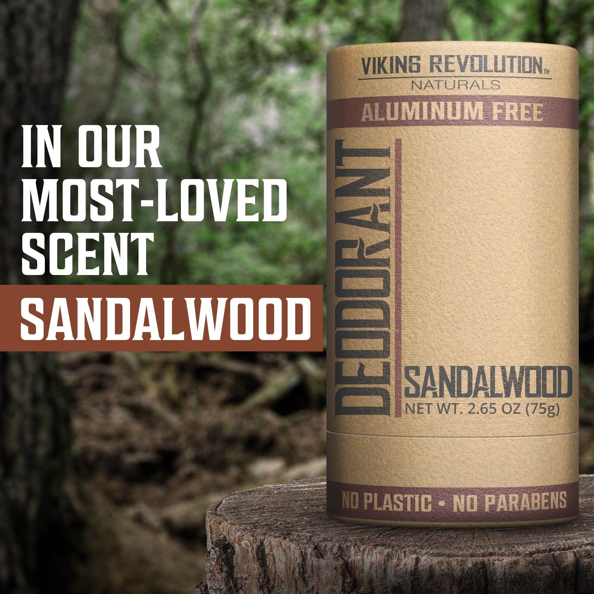 Deodorant - Sandalwood by Viking Revolution rests on a tree stump in the tranquil woods.