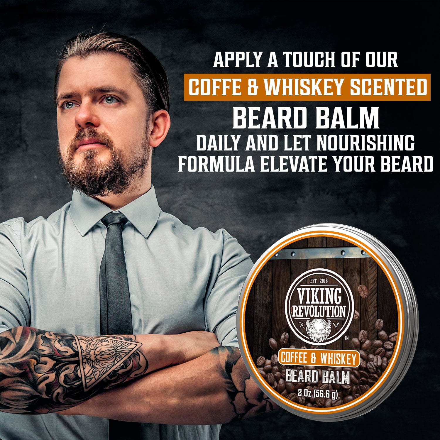 Bearded, tattooed man showcases Viking Revolutions Coffee & Whiskey Beard Balm for sculpted sophistication.