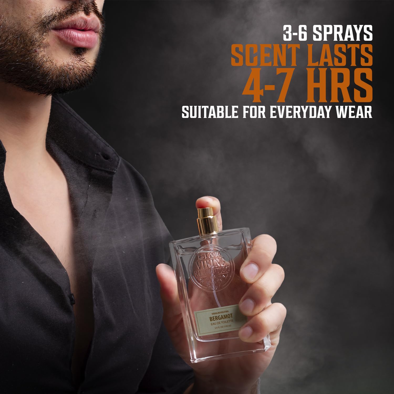A man holding a bottle of Cologne for Men 3.5 fl oz by Viking Revolution ponders its long-lasting spray duration.