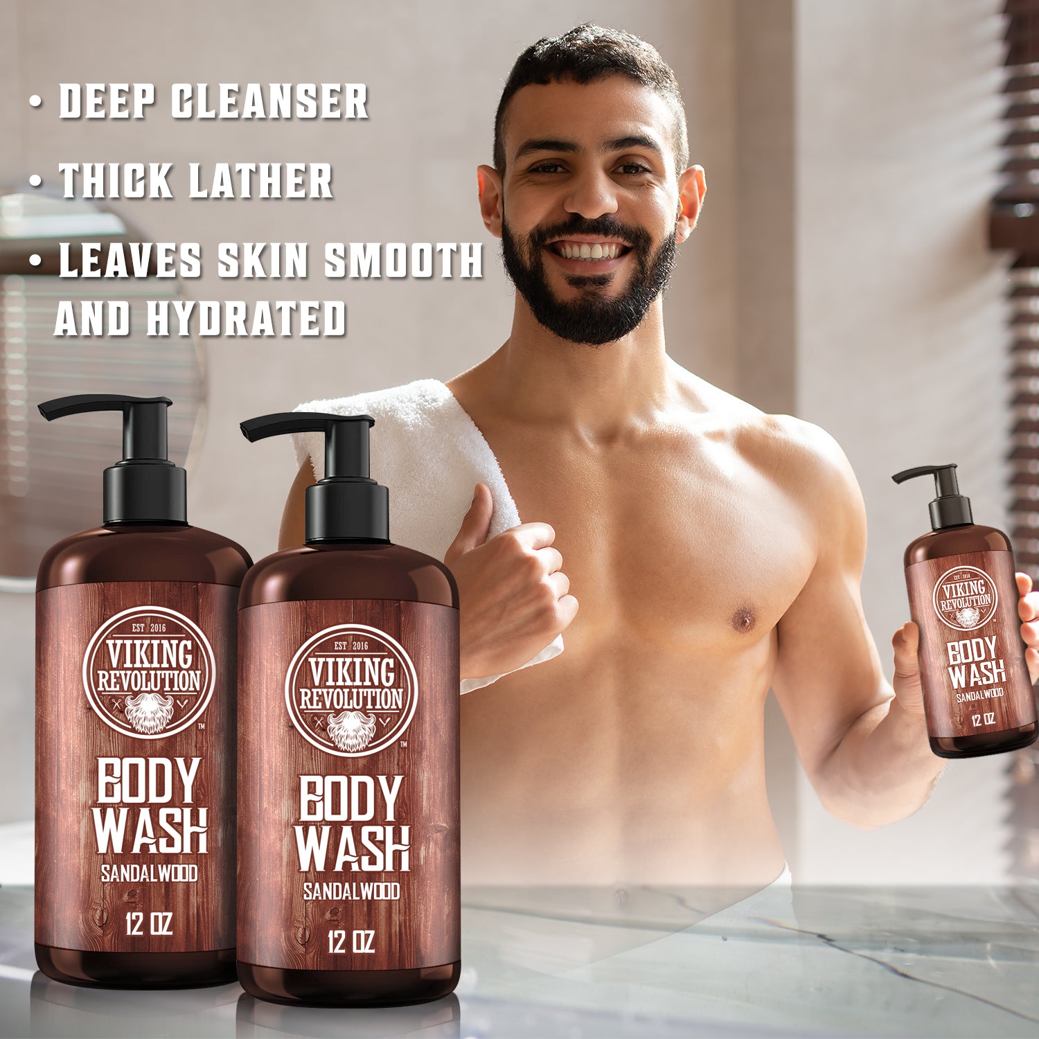 A man relishes his Sandalwood Body Wash - 2 Pack in the bathroom, with skincare product bottles elegantly displayed in the foreground.