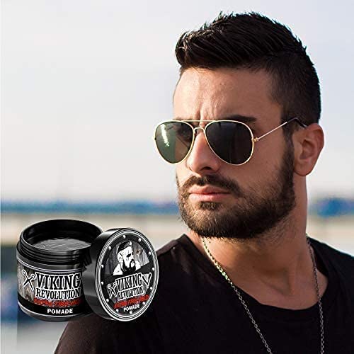 Man with sunglasses and beard next to a jar of Extra Firm Hold - Hair Pomade 4oz by Viking Revolution.