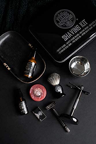 Flat lay of the Luxury Safety Razor Shaving Kit showcasing a classic safety razor, brush, soap, bowl, and essential beard grooming products on a dark surface.