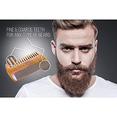 Man with full beard holding Wooden Beard Comb & Case, featuring fine and coarse teeth for grooming.