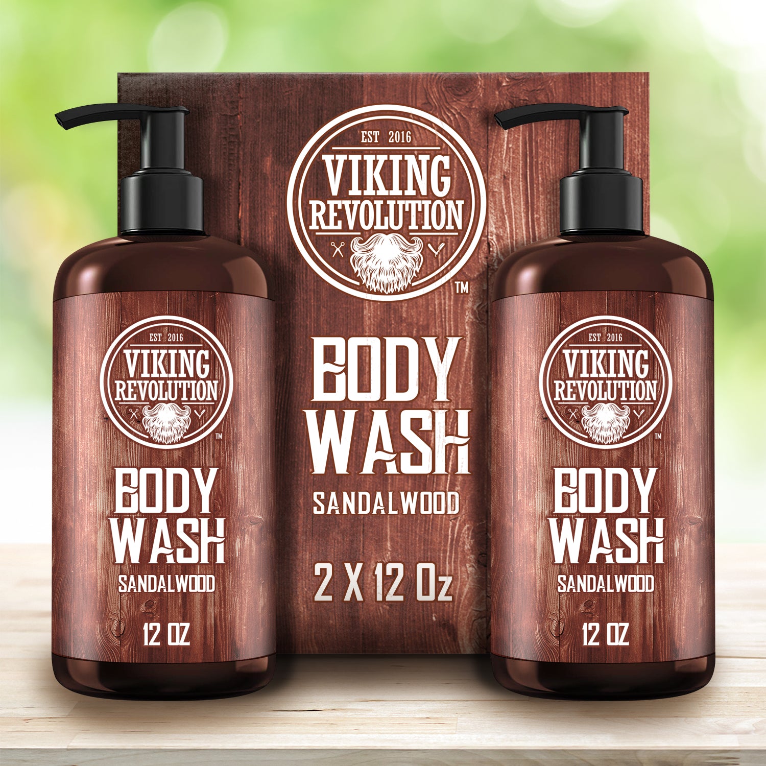 Two bottles of the Sandalwood Body Wash - 2 Pack are prominently displayed in front of a branded box, delivering a premium skincare experience with every sandalwood-infused drop.