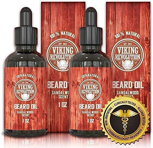 The Sandalwood Beard Oil - 2 Pack from Viking Revolution includes two bottles, each featuring a quality seal. This organic oil also doubles as a beard conditioner, providing a frizz-free grooming experience with its sandalwood scent.