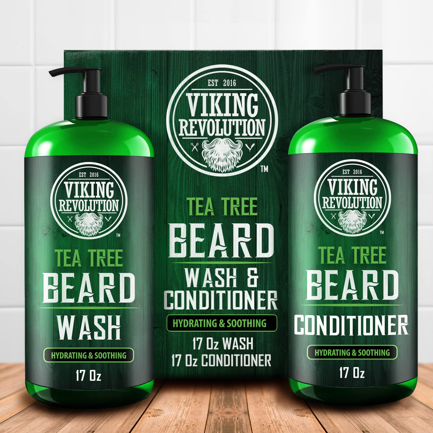 Two bottles of Tea Tree Beard Wash & Beard Conditioner 17oz, crafted with all-natural ingredients for optimal facial hair care, are displayed on a wooden background.