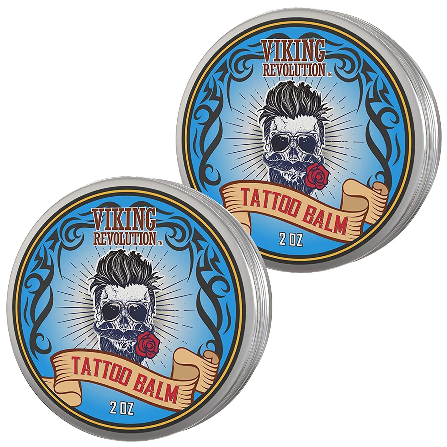 The Tattoo Care Balm - 2 Pack comes in two tins that boast a vibrant blue and vintage tattoo-style design on their labels. This post-treatment cream moisturizes and soothes the skin, promoting effective tattoo healing with its nourishing formula.
