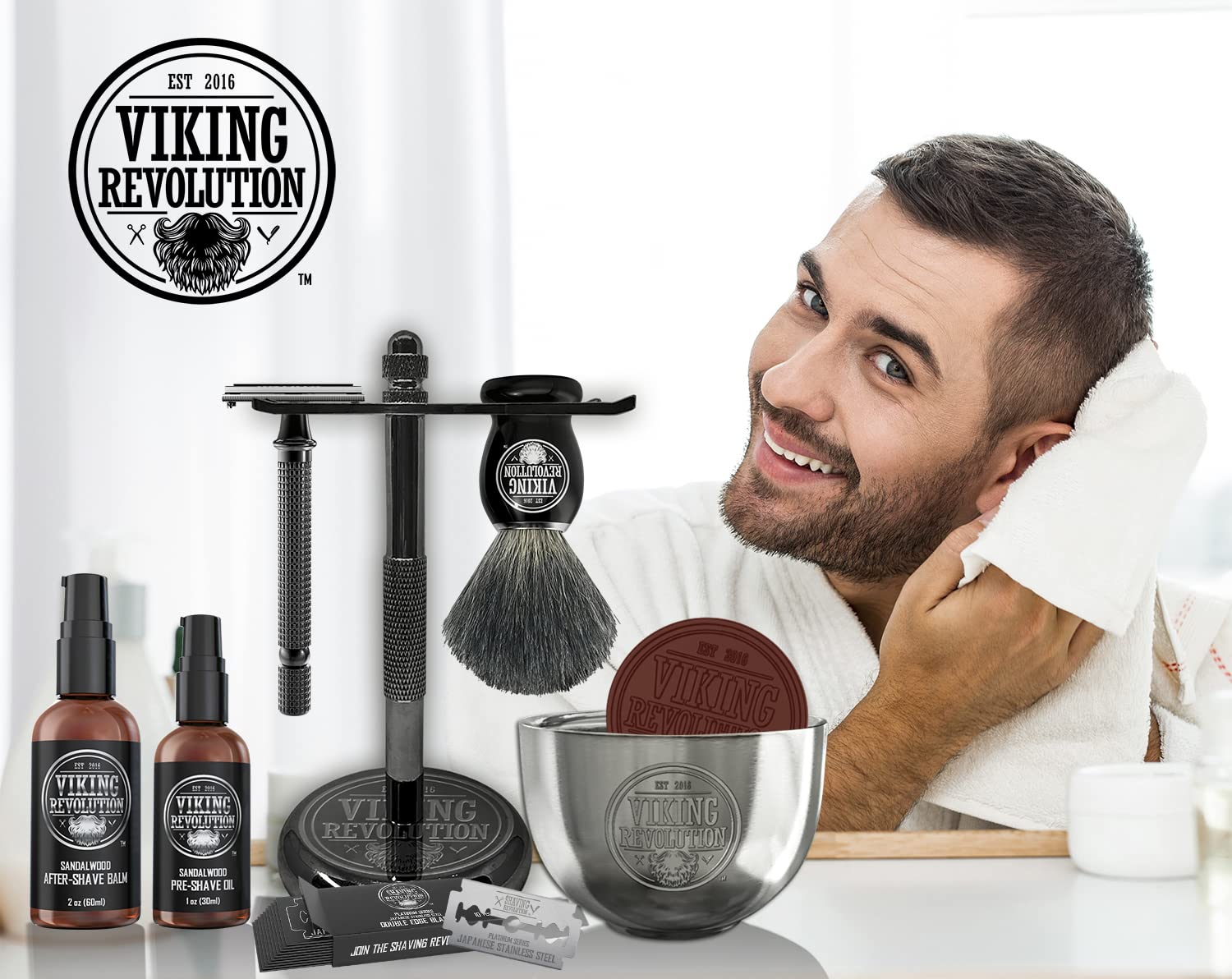 A man is drying his face with a Luxury Safety Razor Shaving Kit beside him, displaying the Viking Revolution logo in the corner.