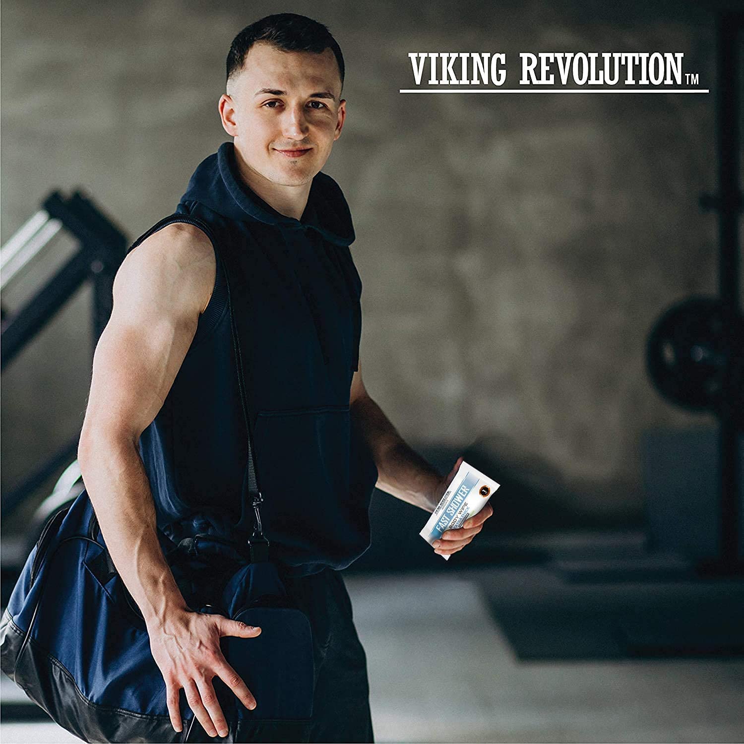 Man in gym holding a sports bag, unscented Body Wipes w/ Vitamin E & Aloe (12 Pack), and a skincare product.