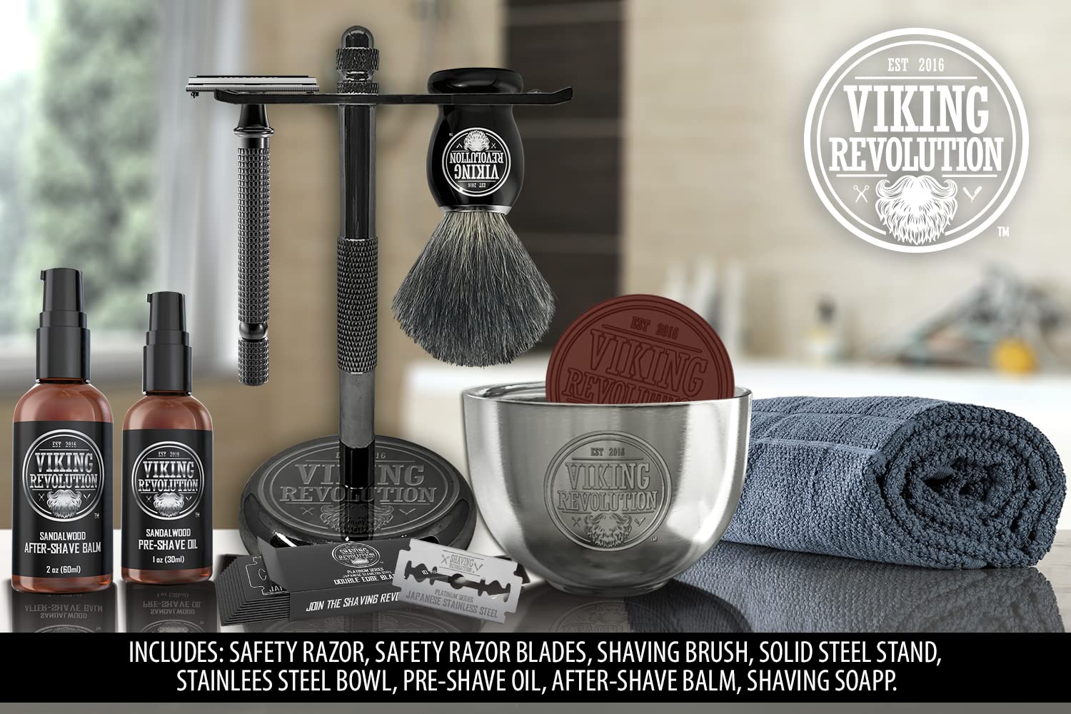 The Luxury Safety Razor Shaving Kit, featuring a safety razor, brush, blades, bowl, soap, oil, balm, and towel on a table is perfect for beard grooming.