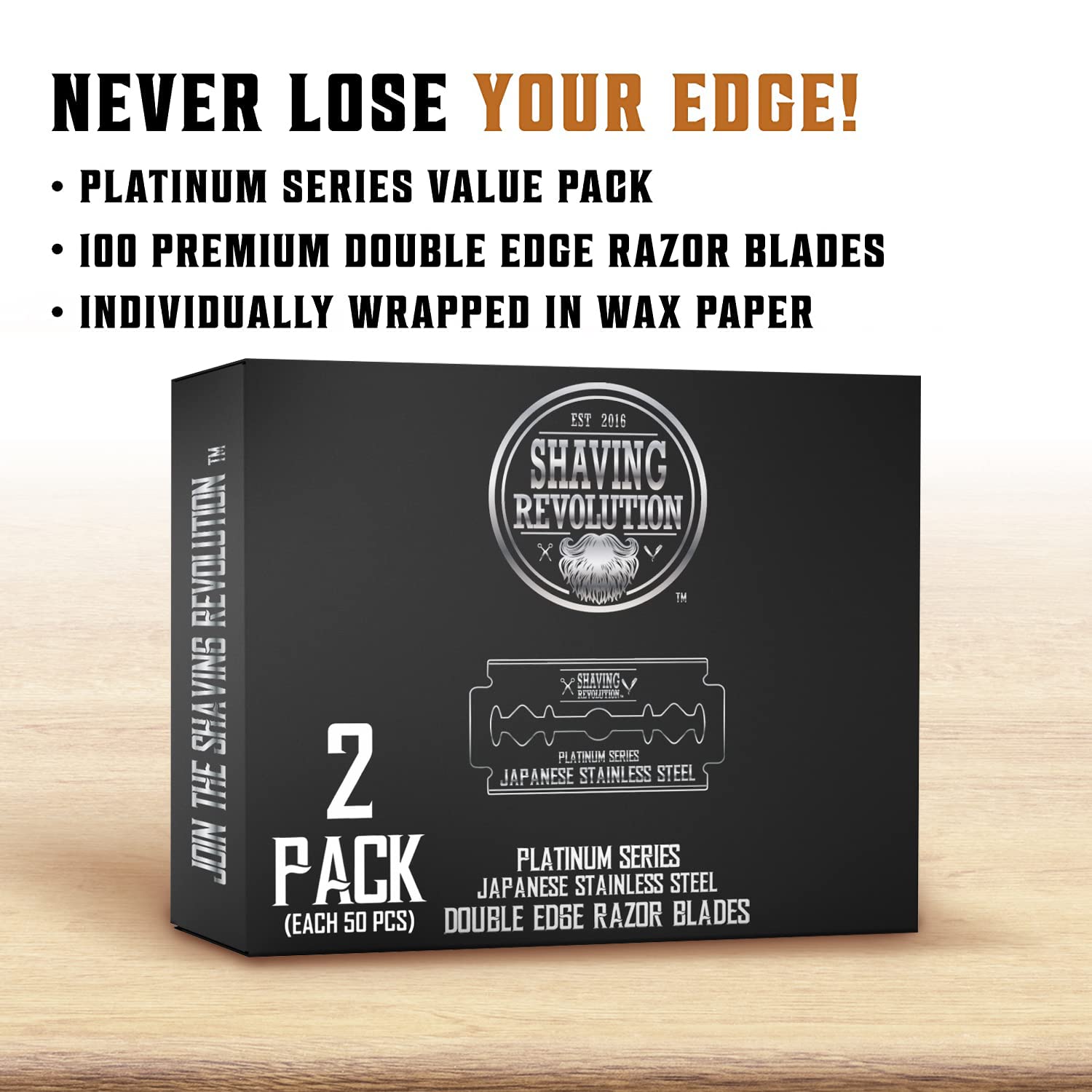 A box of Double Edge Razor Blades (100 Count), crafted with premium Japanese stainless steel, sits elegantly on a wooden surface with promotional text above. Ideal for those seeking precision and quality in their shave.