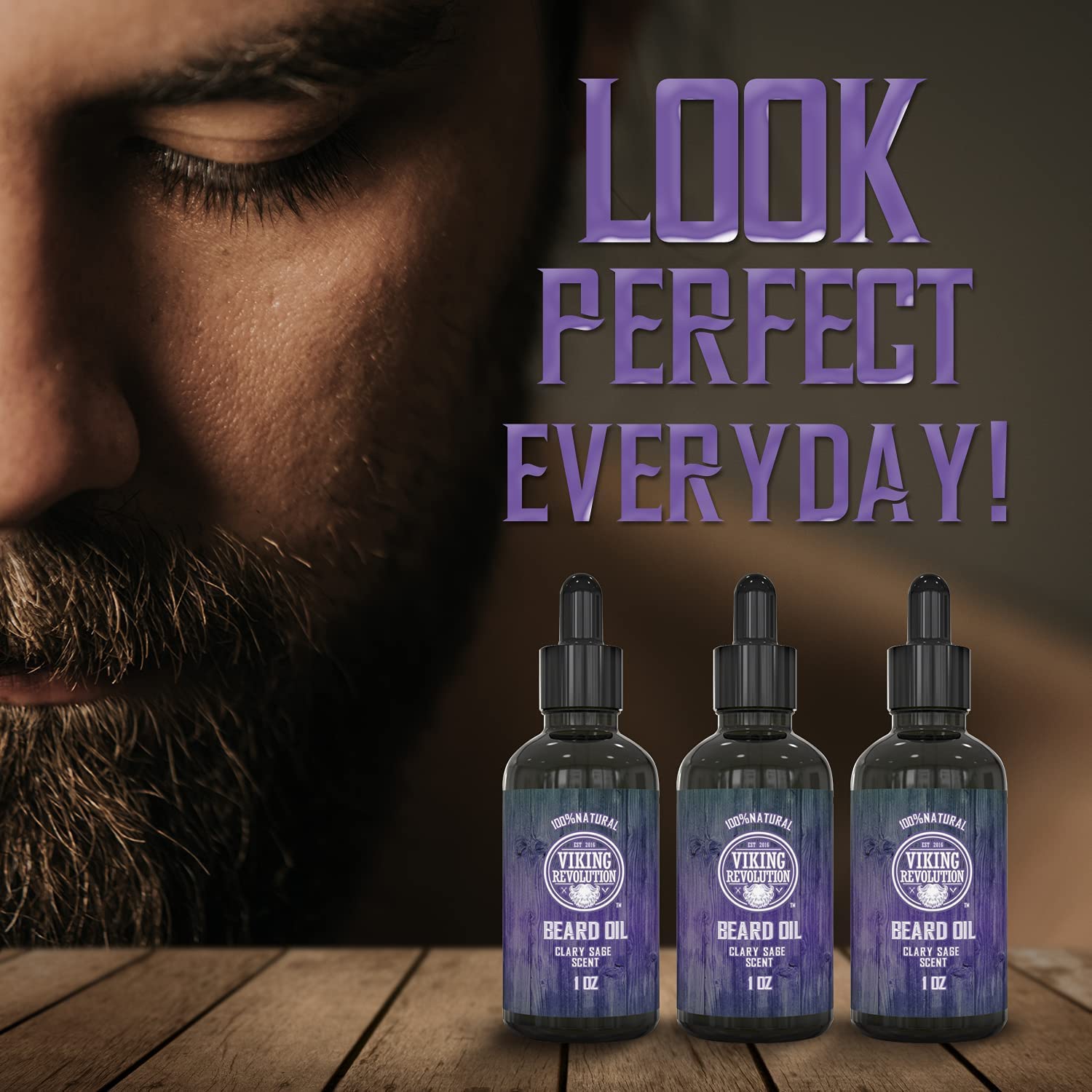 Close-up of bearded man with Clary Sage Beard Oil - 3 Pack from Viking Revolution on wood surface.