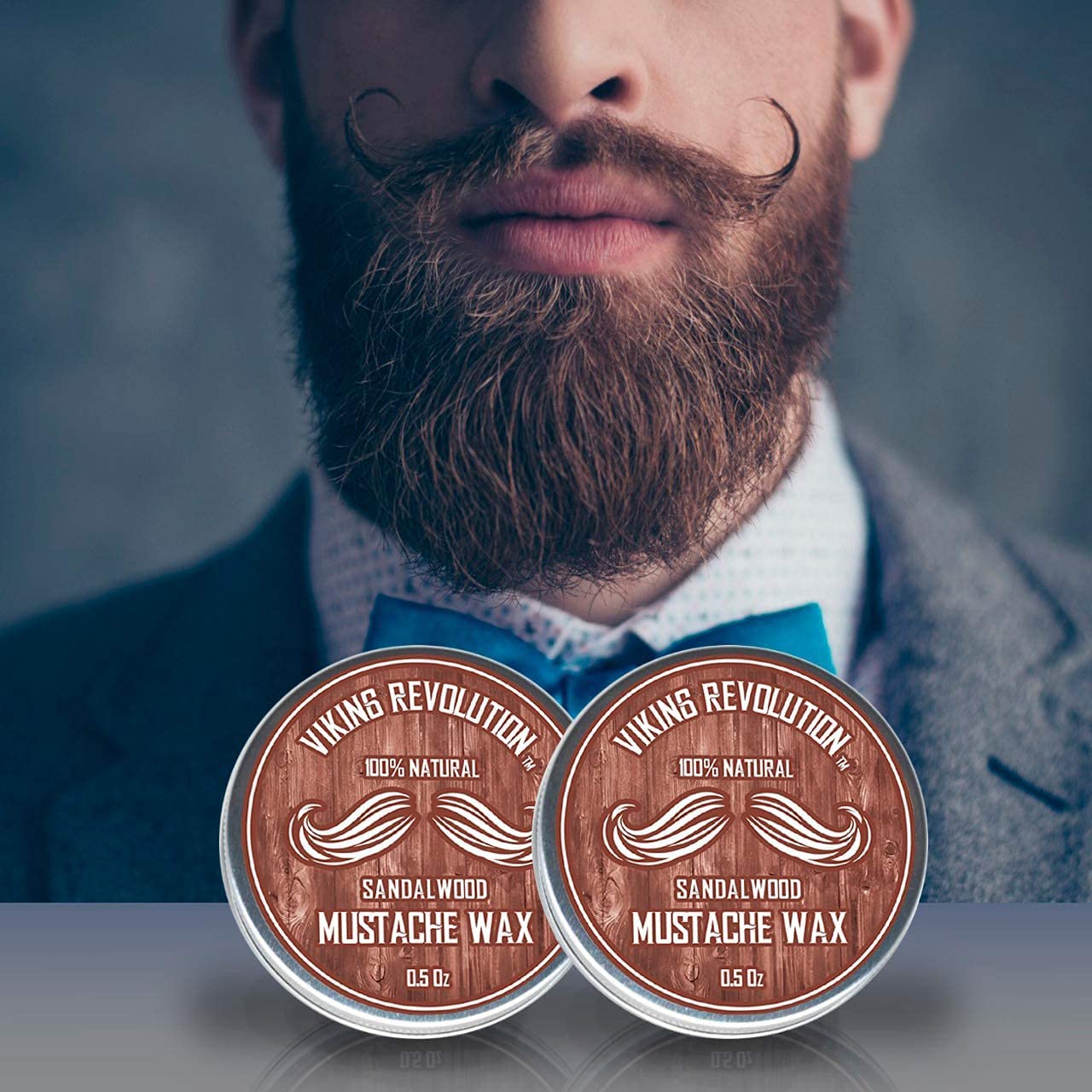 Man with styled mustache and beard, wearing a bow tie, showcases Sandalwood Mustache Wax - 2 Pack.