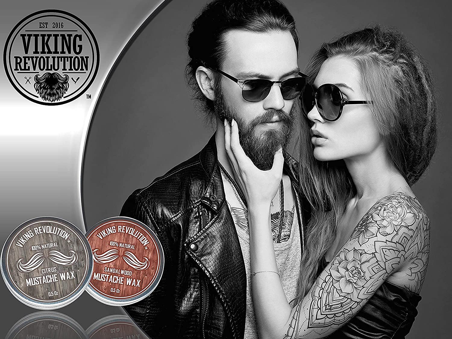 Stylish couple in sunglasses, woman touching mans beard, using Citrus & Sandalwood Mustache Wax.