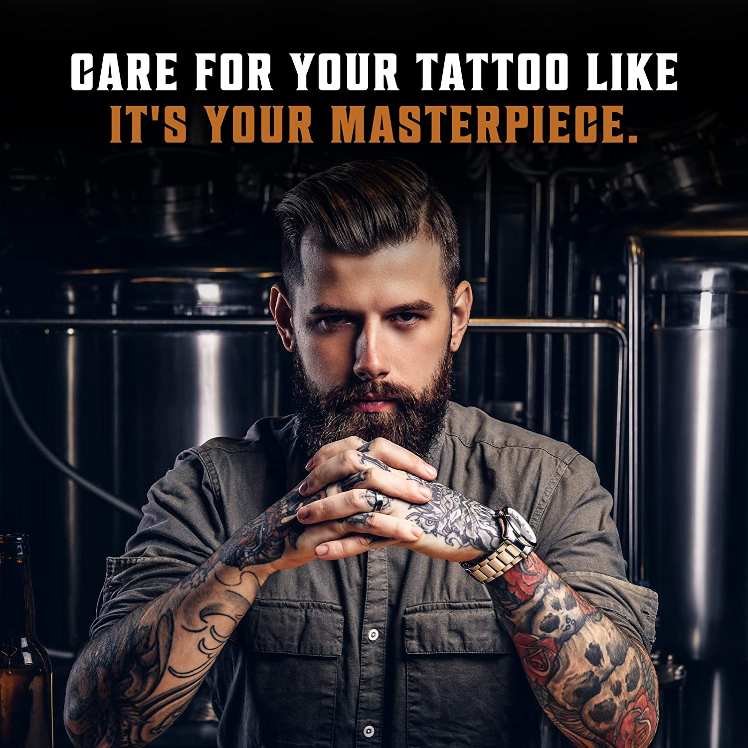 A bearded man with tattoos strikes a confident pose; text: Treat your tattoo like a masterpiece using Tattoo Care Balm, made with vegan ingredients.