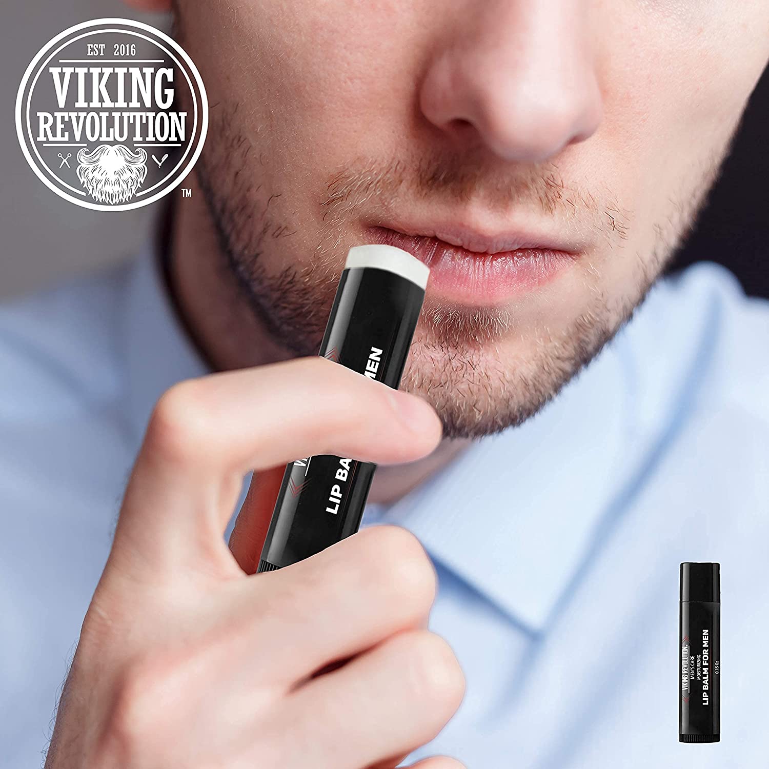 A man is applying a sleek tube of All Natural Lip Balm for Men - 4 Pack, enriched with Vitamin E. The Viking Revolution logo is prominently displayed on the top left corner, highlighting its commitment to all-natural ingredients for superior care.