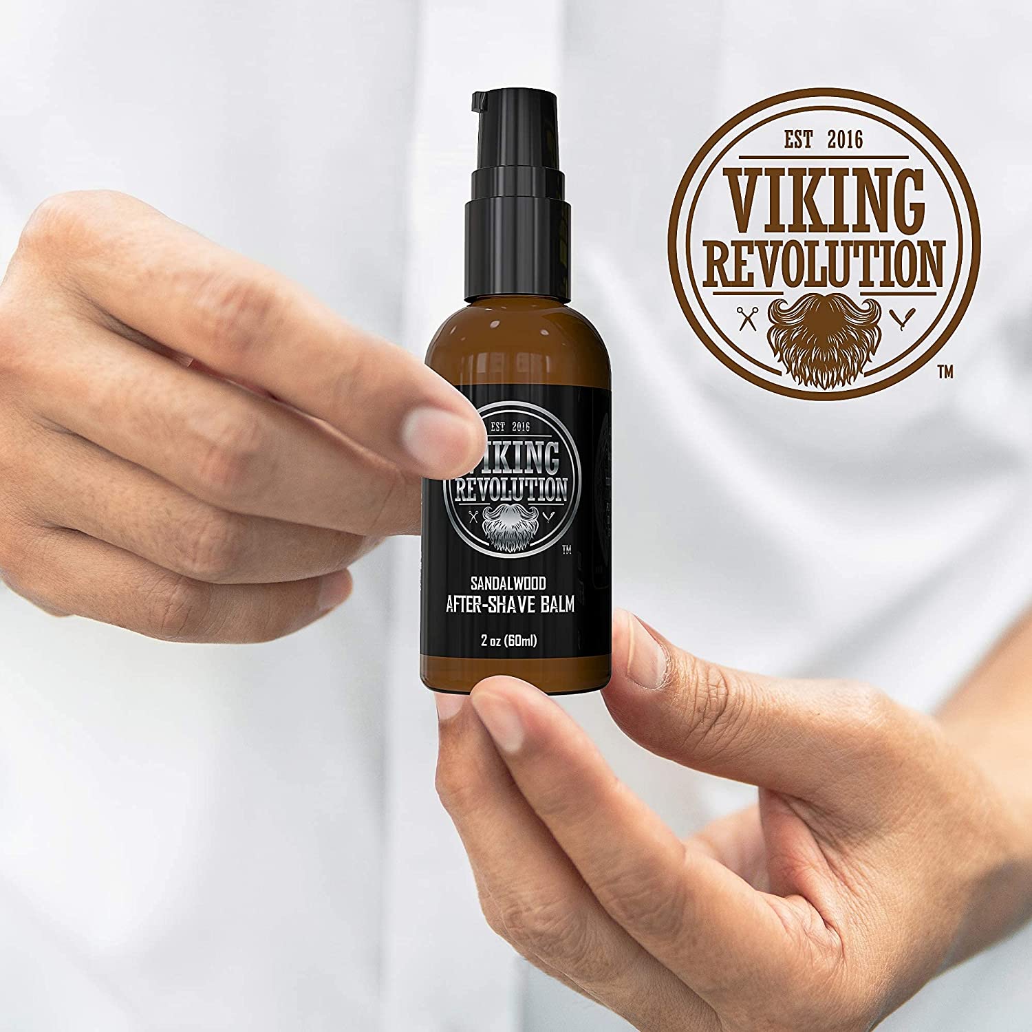 Hand holding Sandalwood After-Shave Balm for Men; Viking Revolution logo in the background.