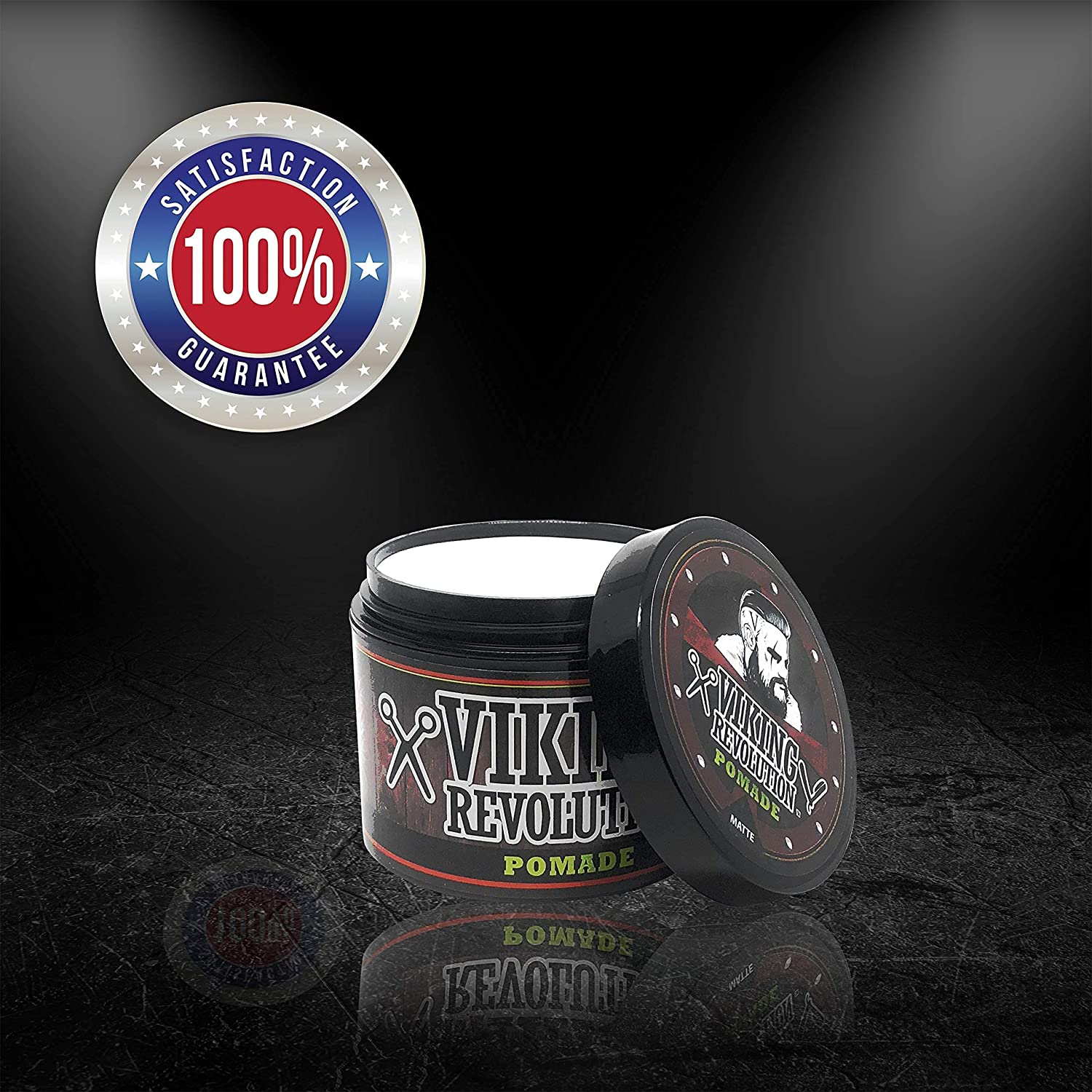Under the spotlight, an open jar of Medium Hold Hair Pomade 4oz shines, proudly displaying a 100% Satisfaction Guarantee badge for those seeking a natural matte finish.