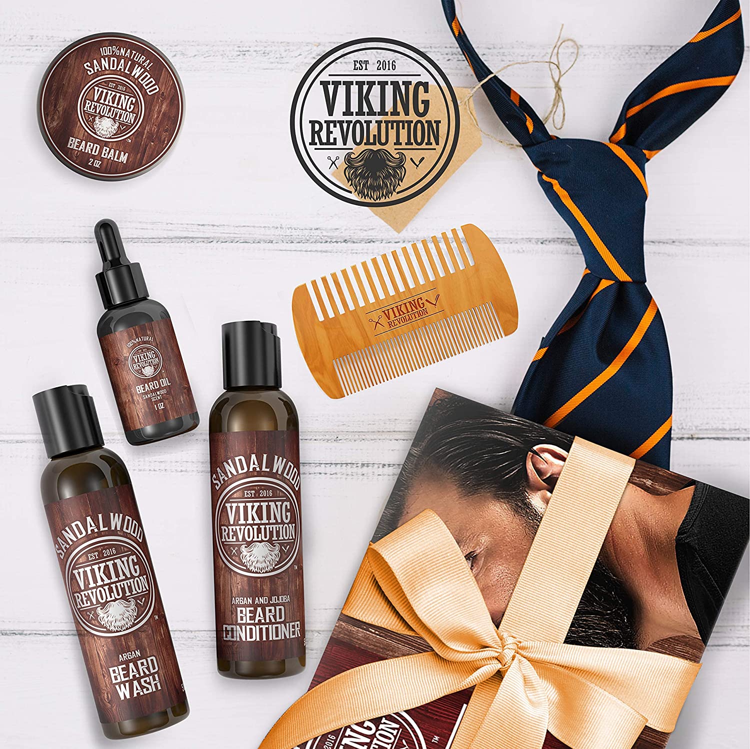 Sandalwood Grooming Kit featuring beard styling products, a sandalwood-scented wooden comb, tie, and a gift box with ribbon.