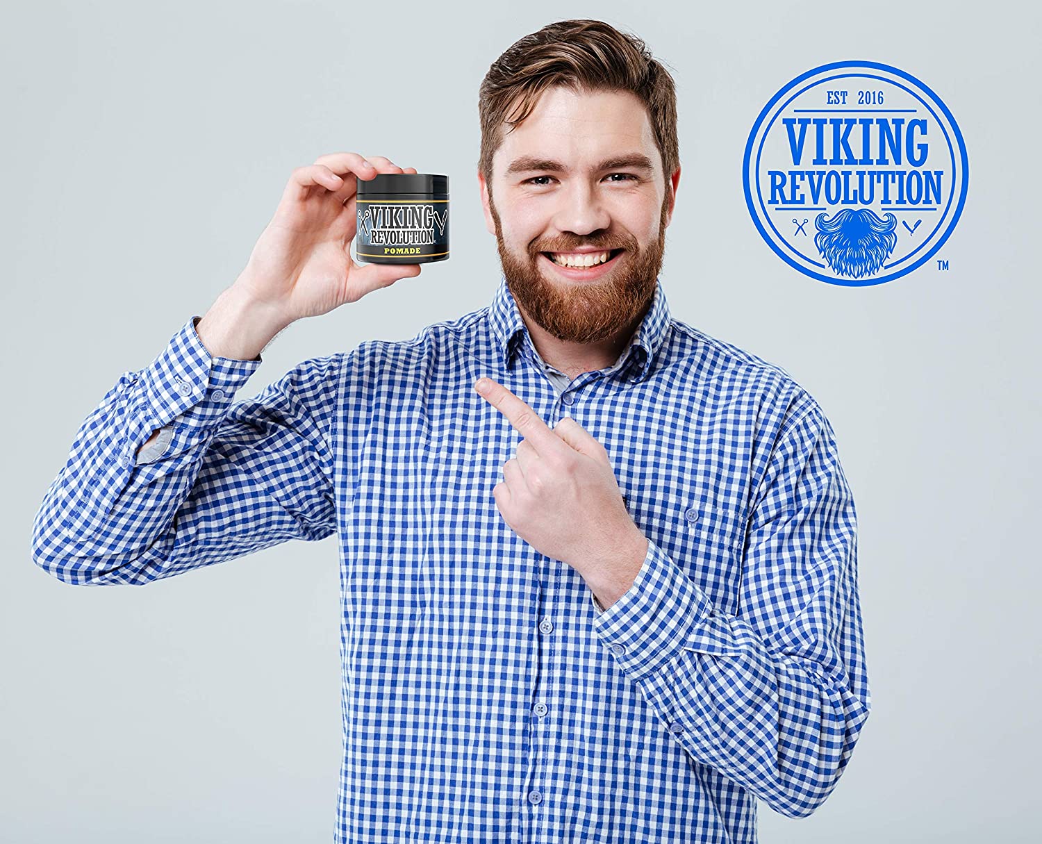 Man in checkered shirt points to Firm Hold Hair Pomade - 4 oz, ideal for a high shine finish.