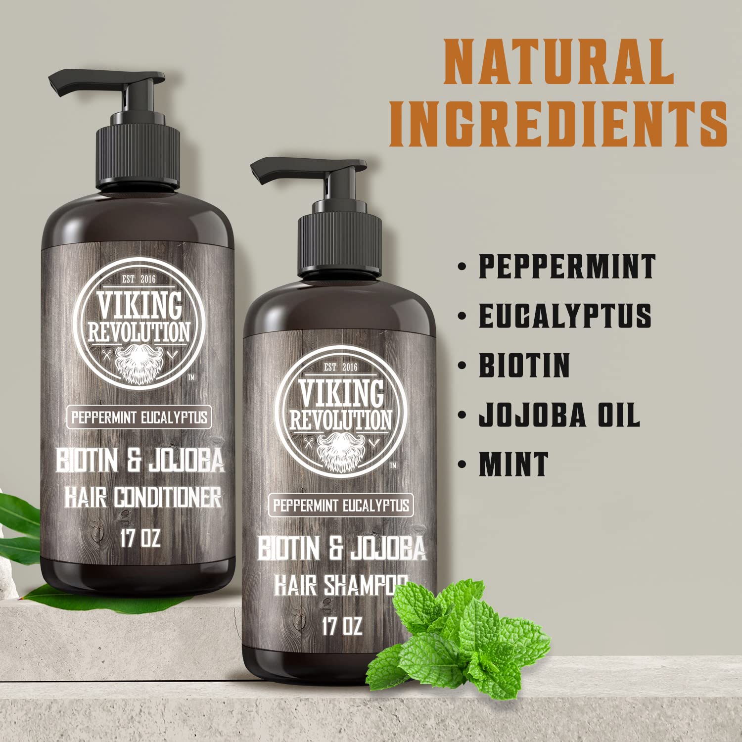 Two bottles of Eucalyptus and Peppermint Shampoo and Conditioner Set (17 Oz) with mint leaves.