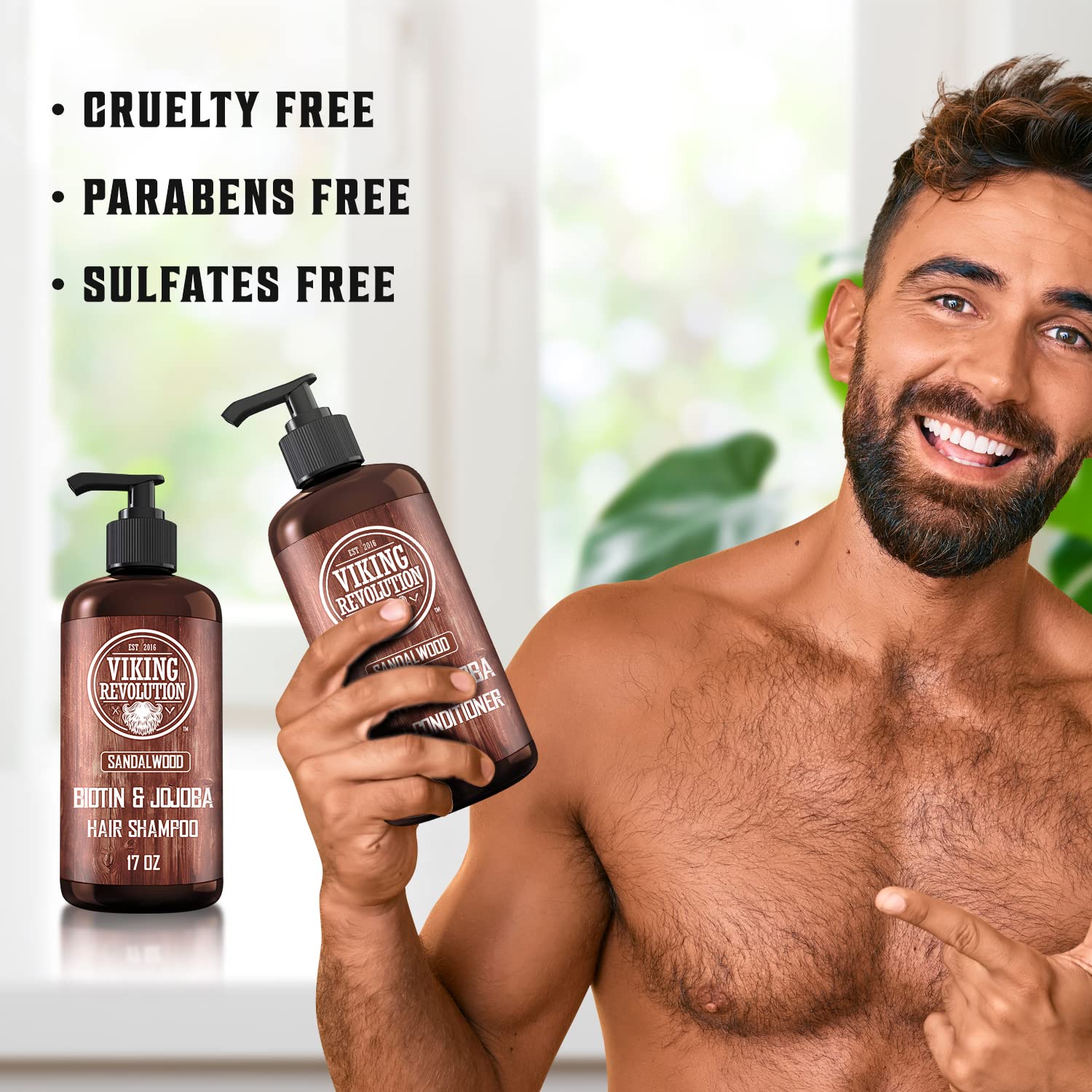 A man holds a bottle of Sandalwood Shampoo and Conditioner Set, proudly showcasing the text: Cruelty Free, Parabens Free, and Sulfates Free. In the background, more bottles from the Sandalwood collection line the shelves.